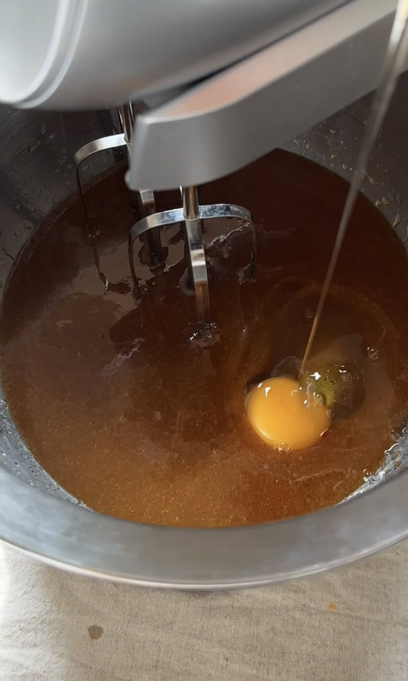 adding eggs into the blondie batter.