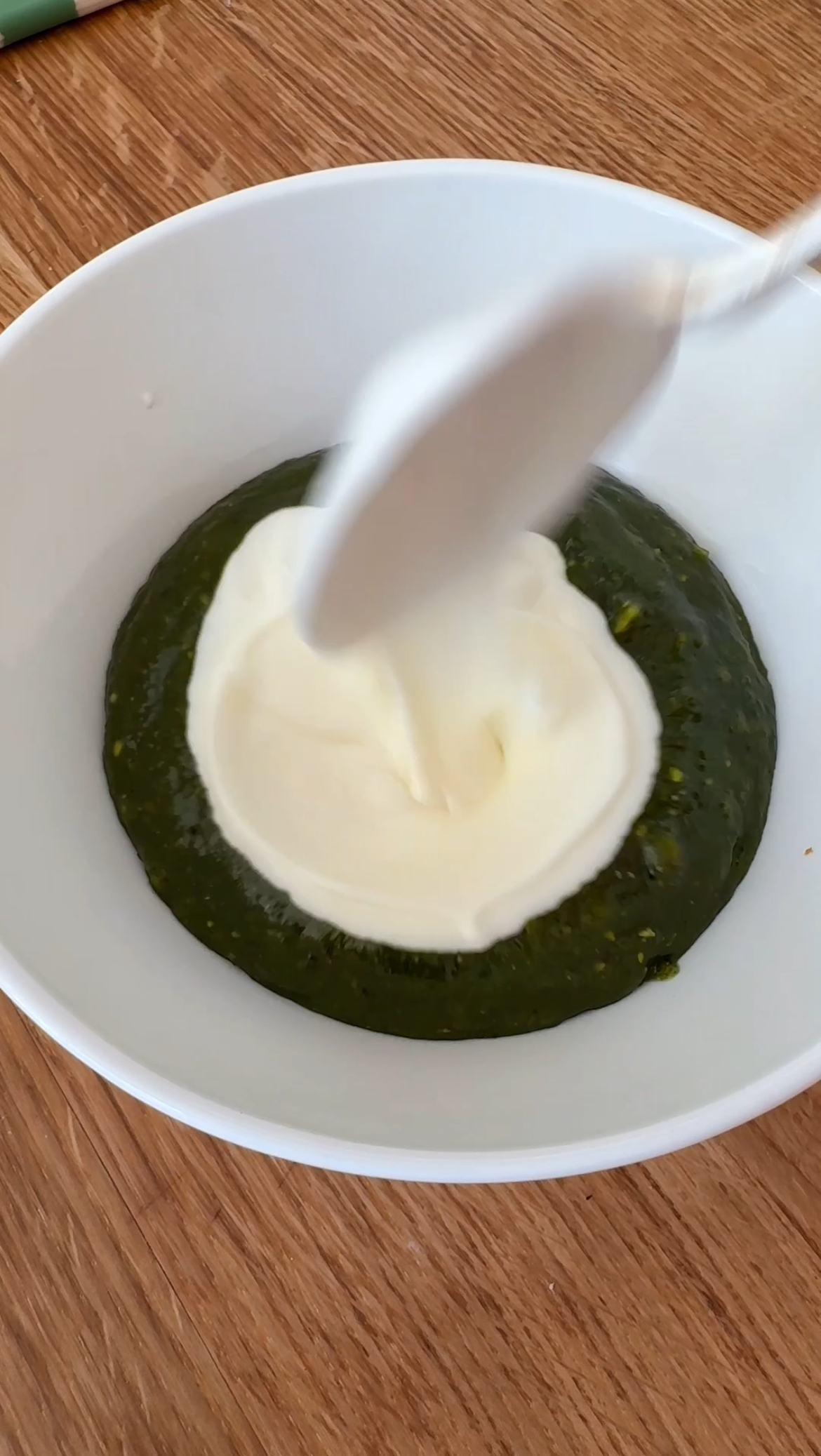 adding yoghurt to pesto dressing