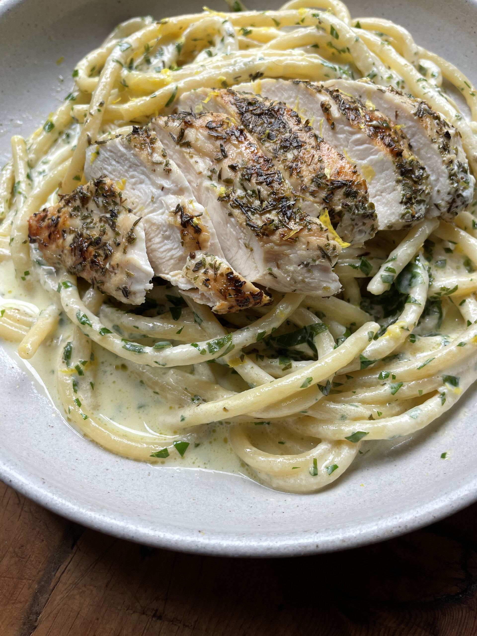 creamy chicken pasta in white bowl