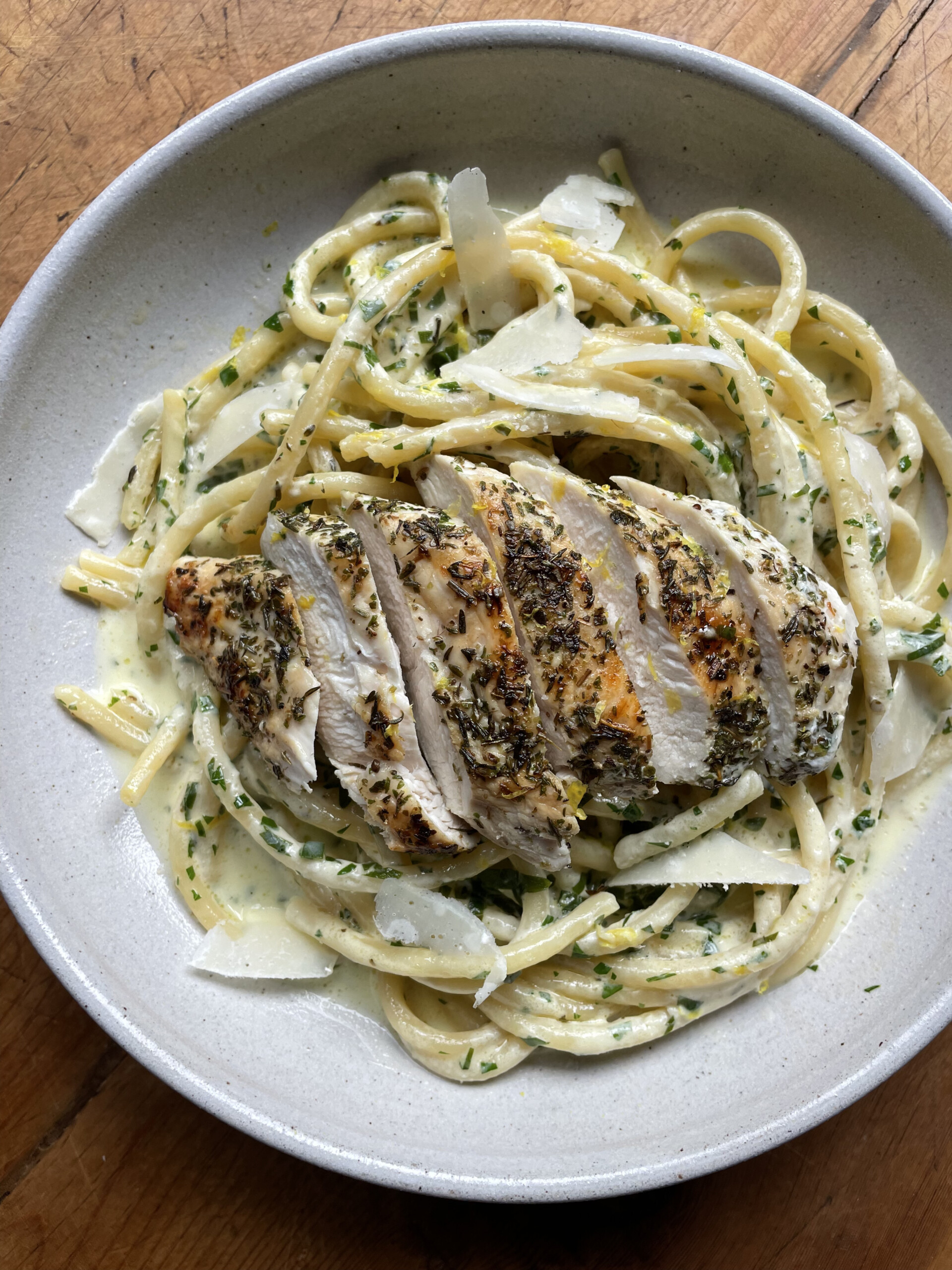 creamy chicken pasta in white bowl