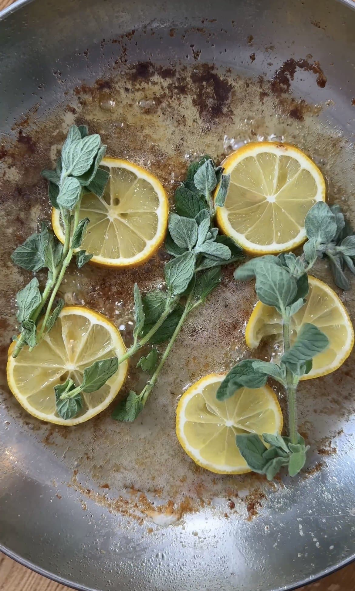 frying lemon and oregano in butter.