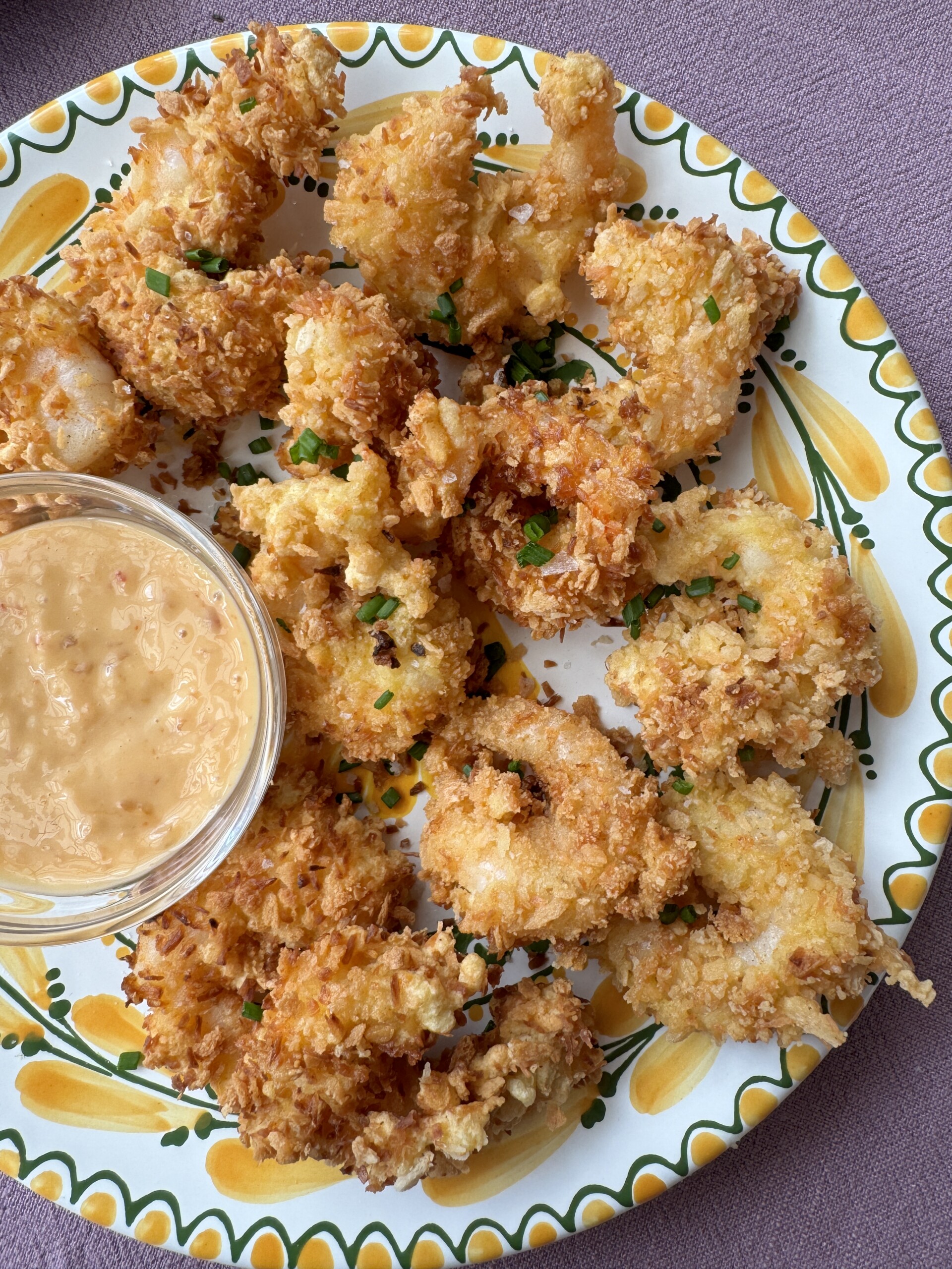 panko shrimp on a plate with dipping sauce