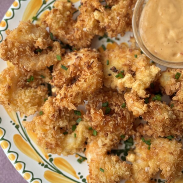 panko shrimp on a plate with dipping sauce