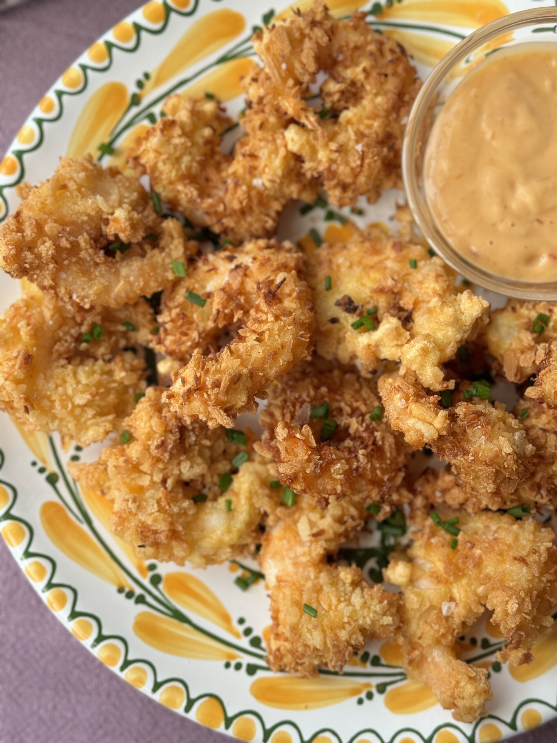 panko shrimp on a plate with dipping sauce