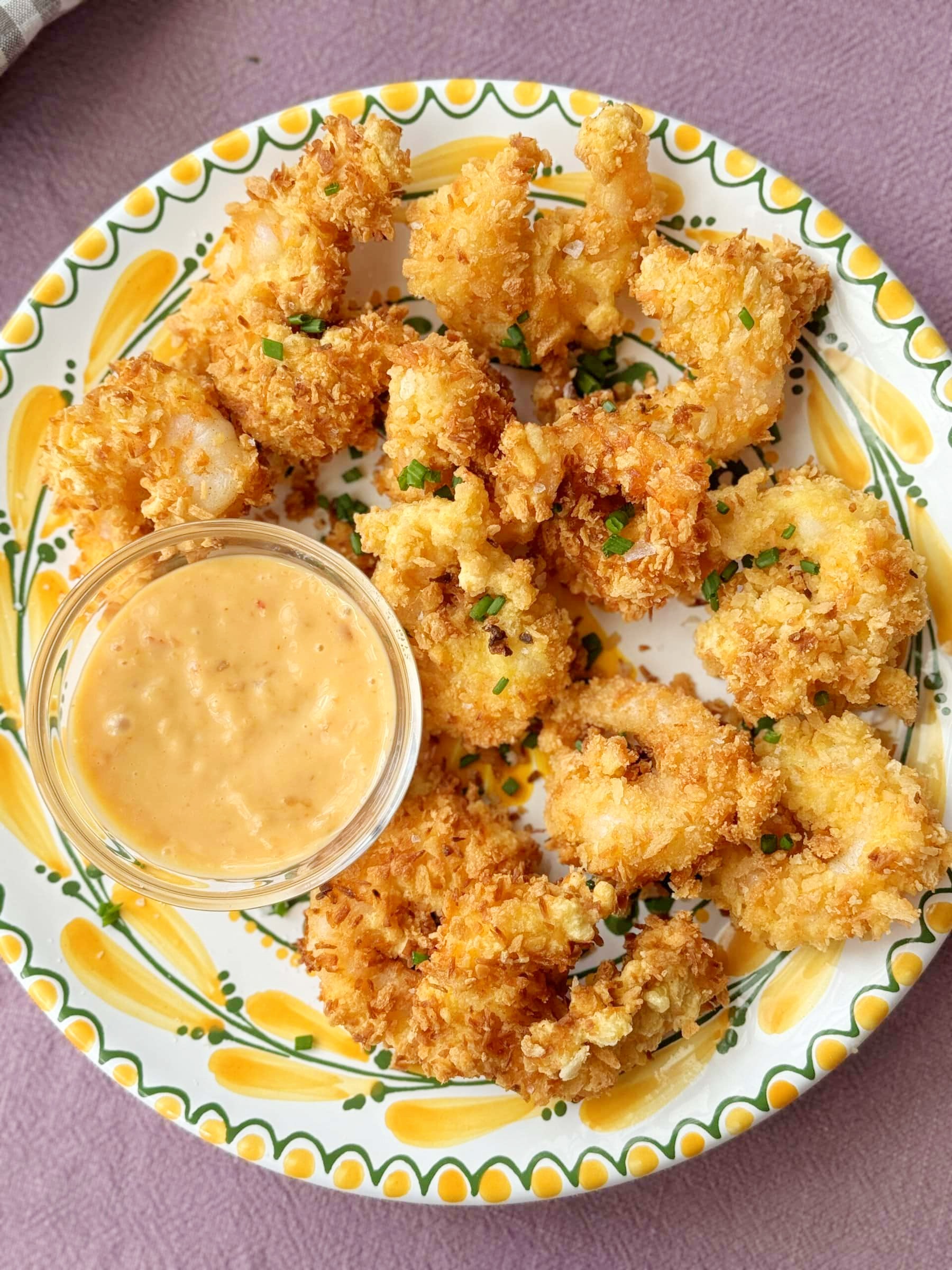 panko shrimp on a plate with dip.