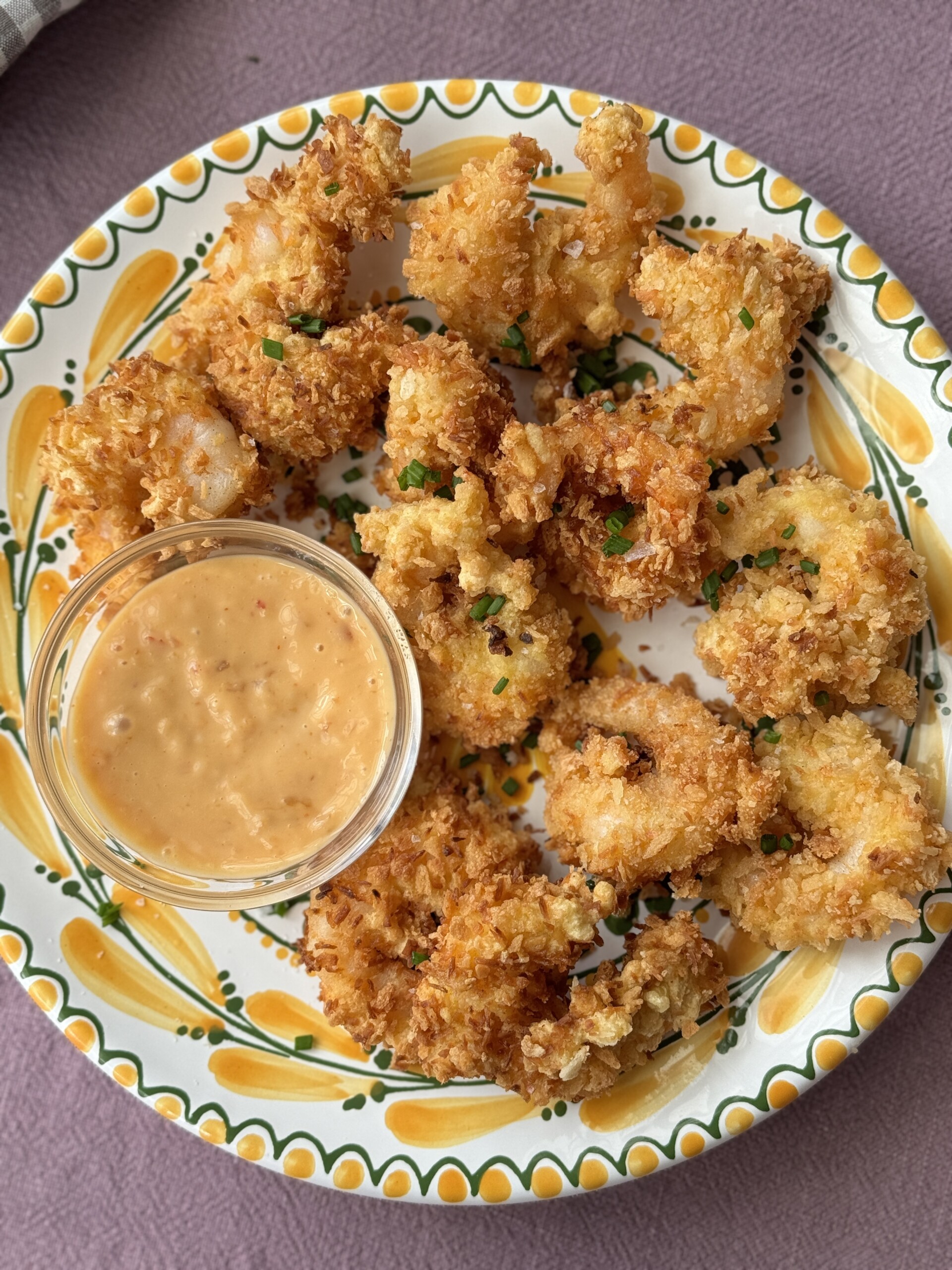 panko shrimp on a plate with dipping sauce