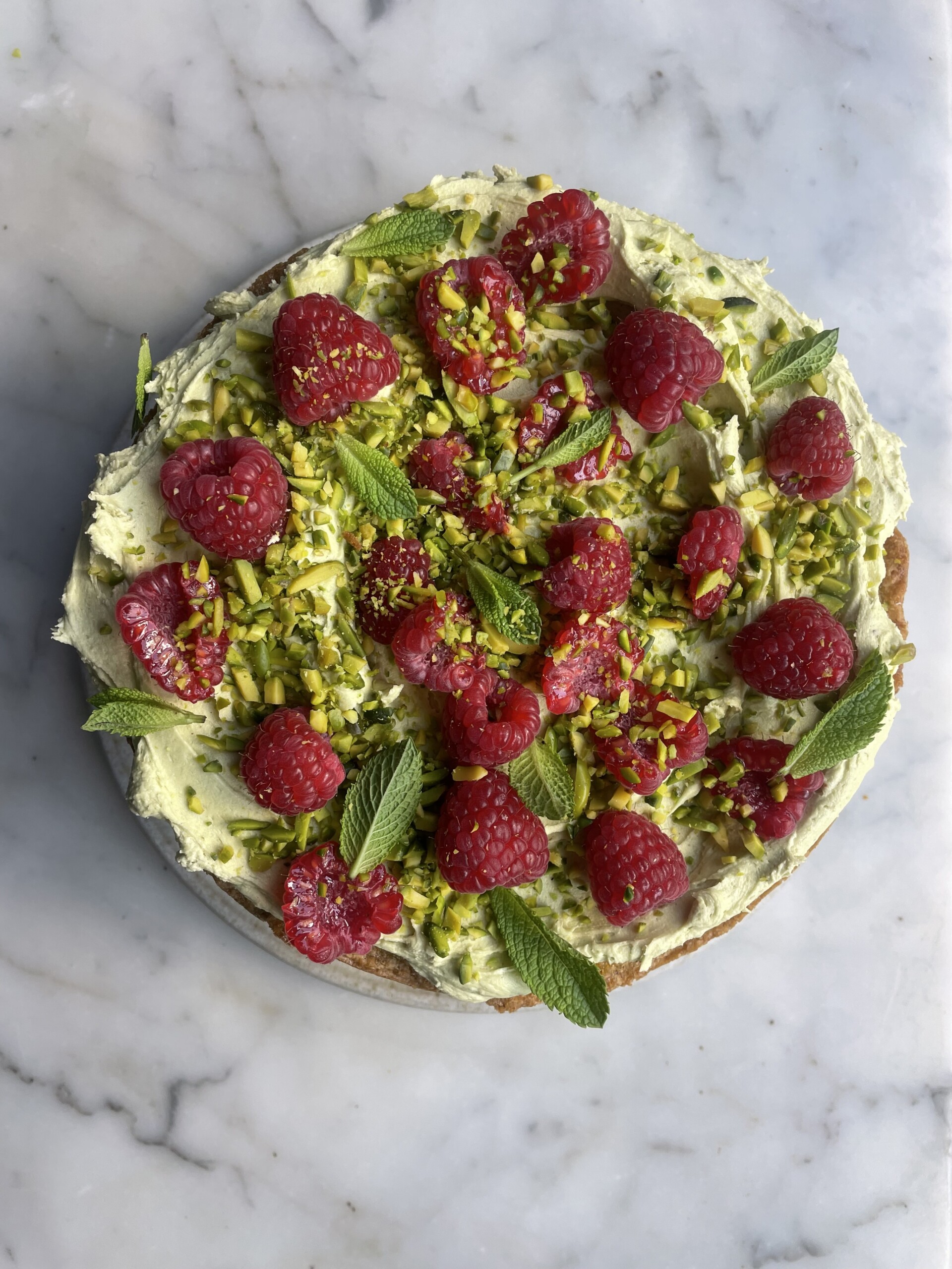 birds eye view of pistachio raspberry cake