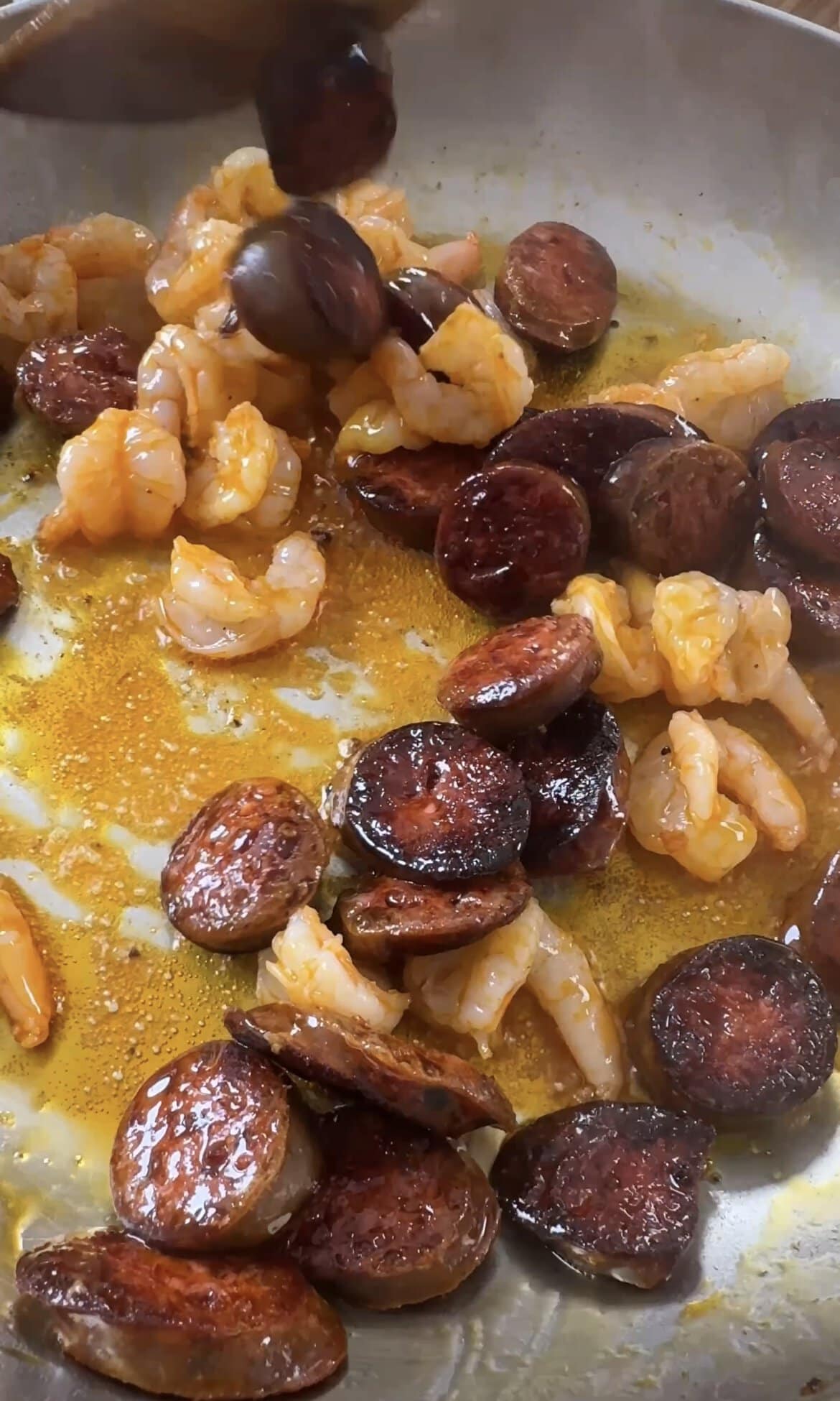 frying prawns and chorizo.