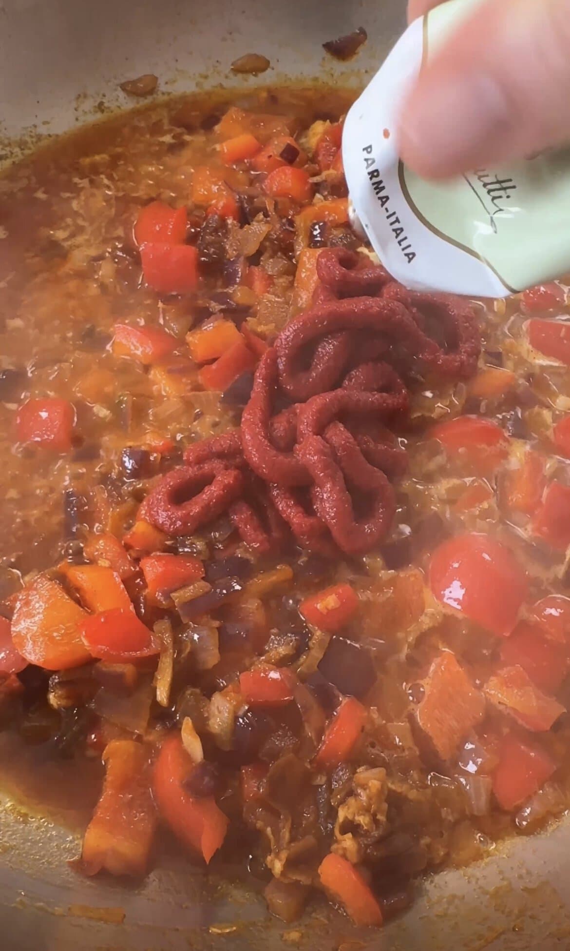 adding tomato puree.