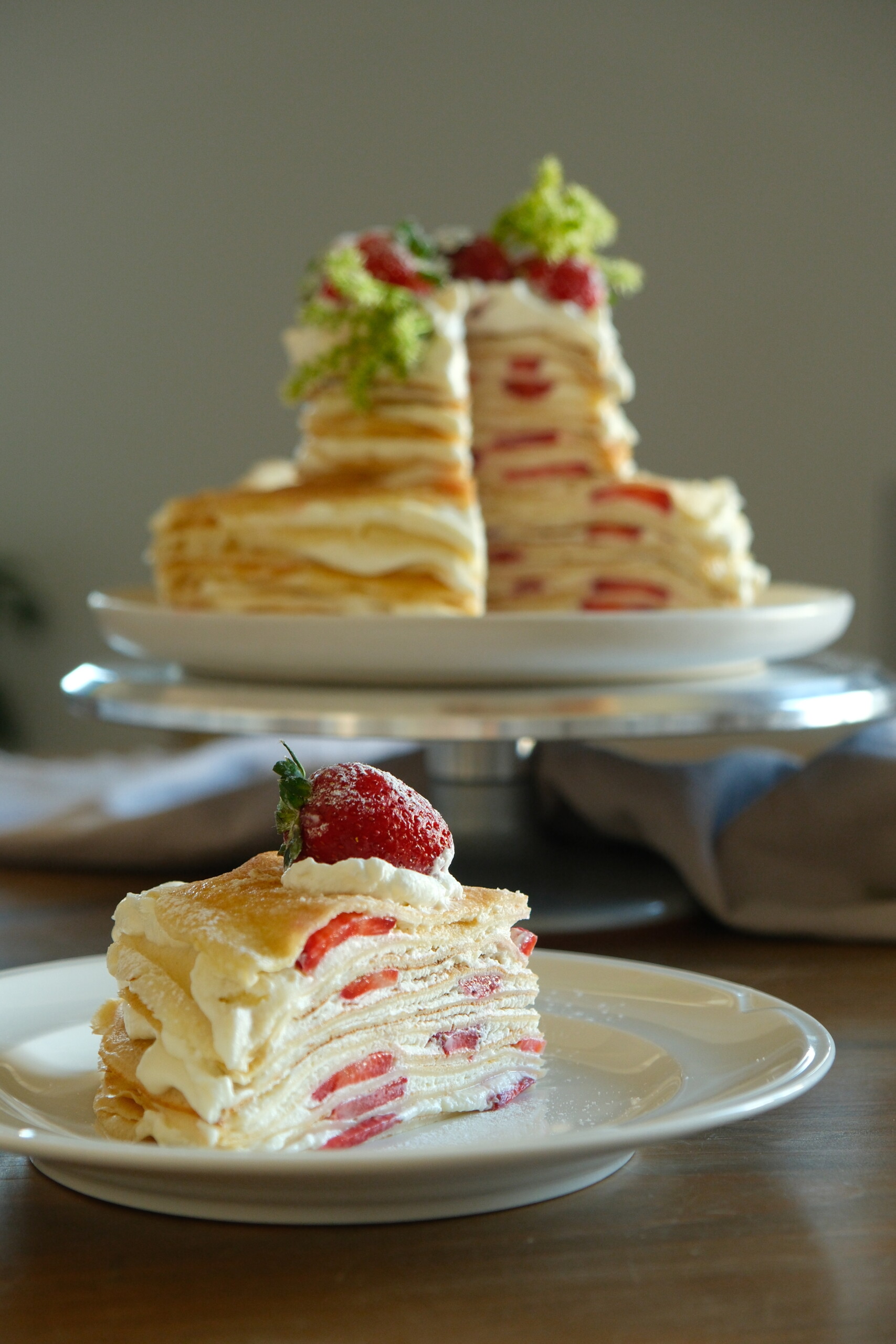 slice of strawberry mille crepe cake