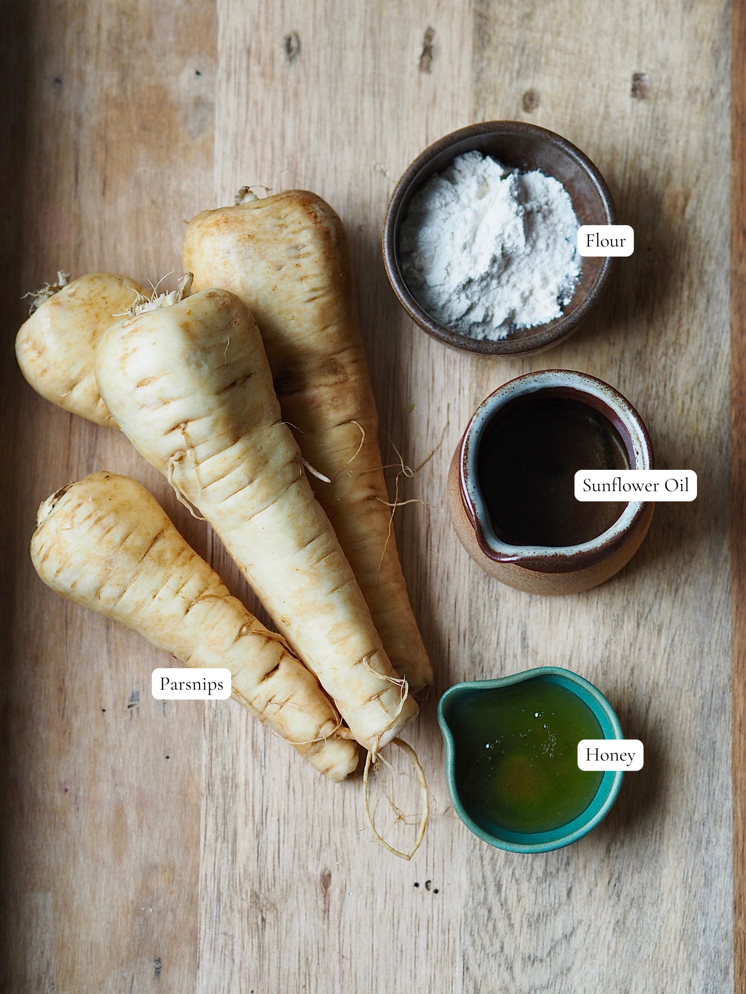 Labelled ingredients to make air fryer honey glazed parsnips.