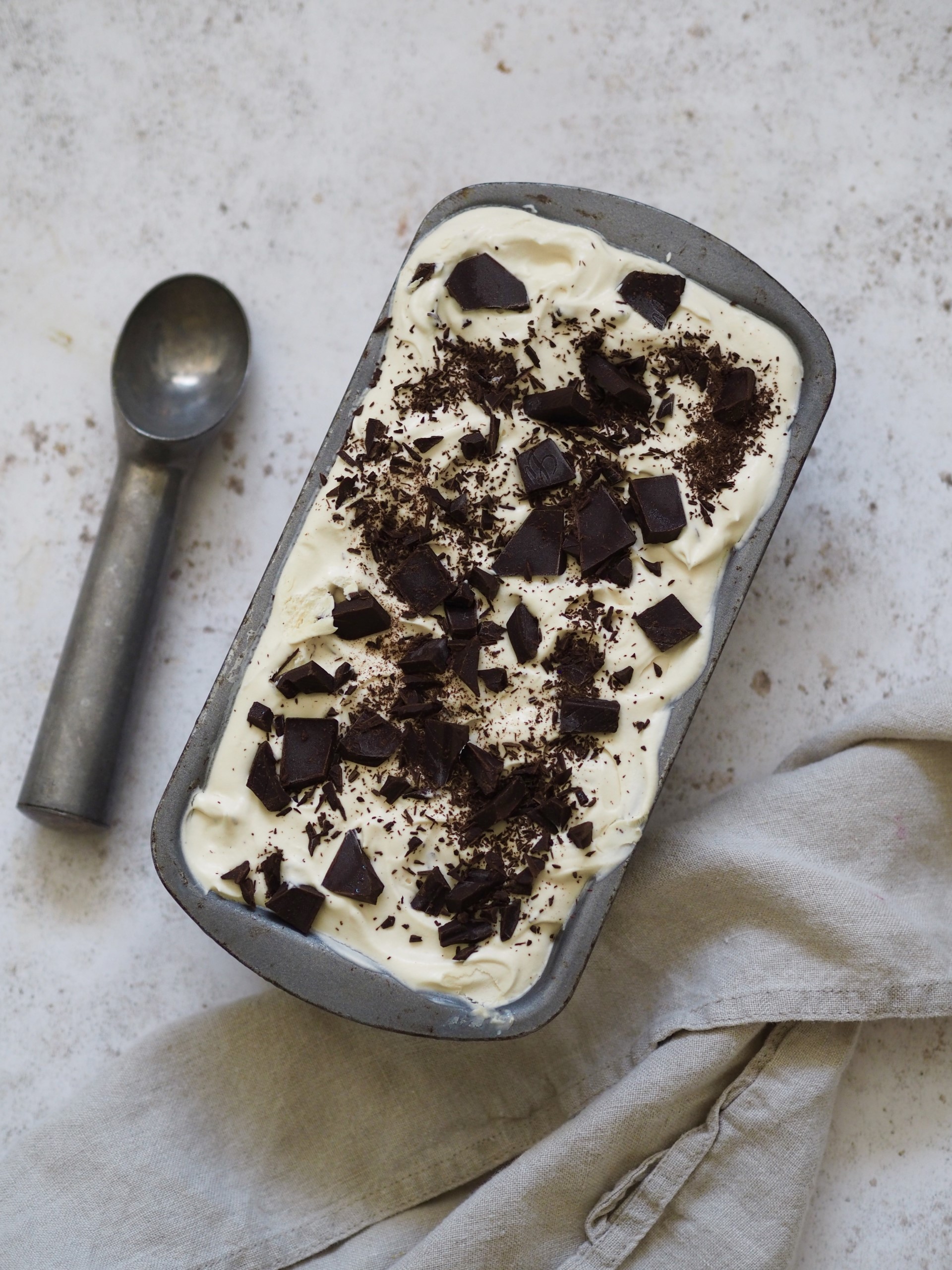 Baking tin with Baileys Ice cream and scoop