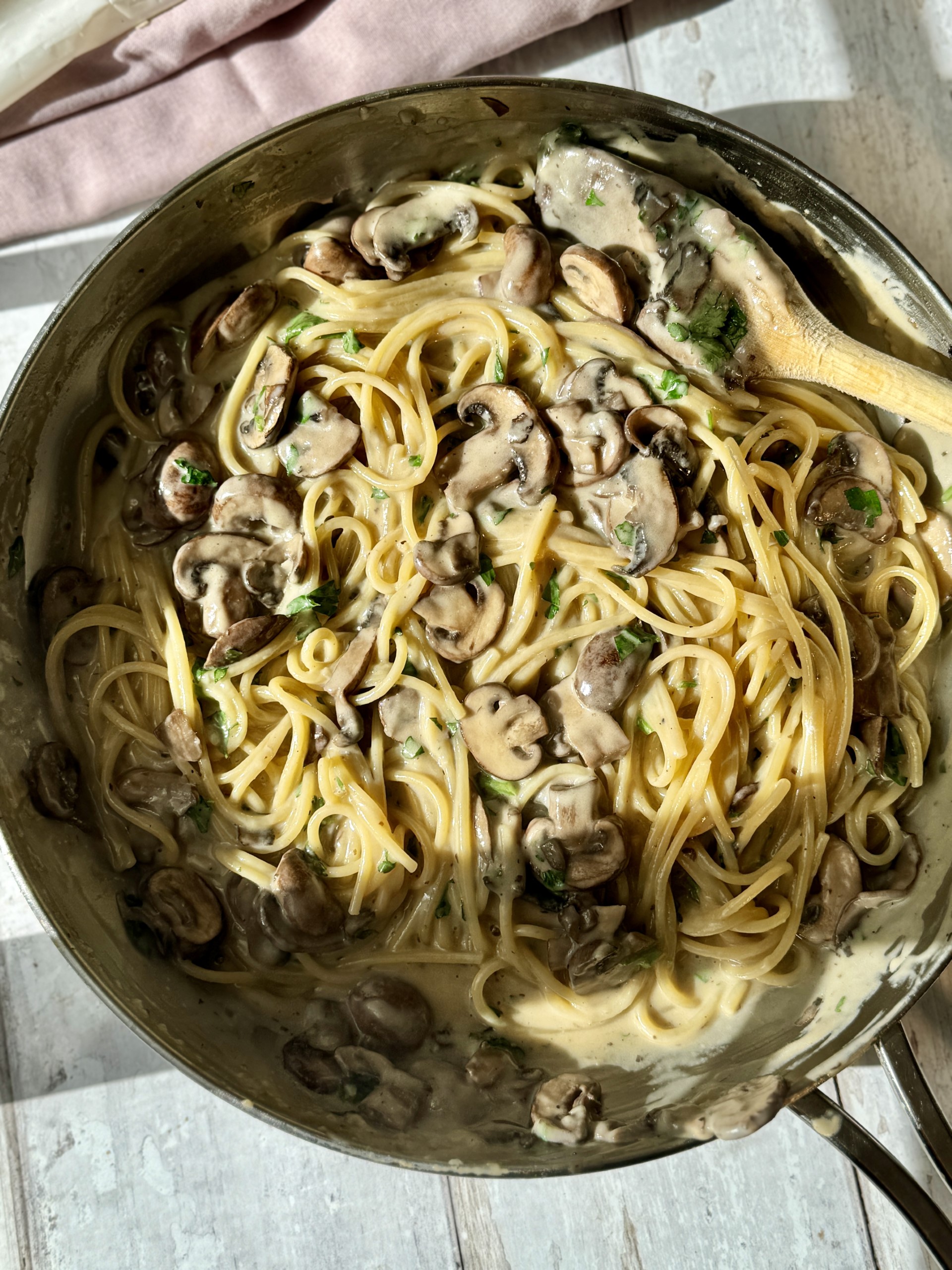 Stirring Creamy Mushroom Pasta in pan