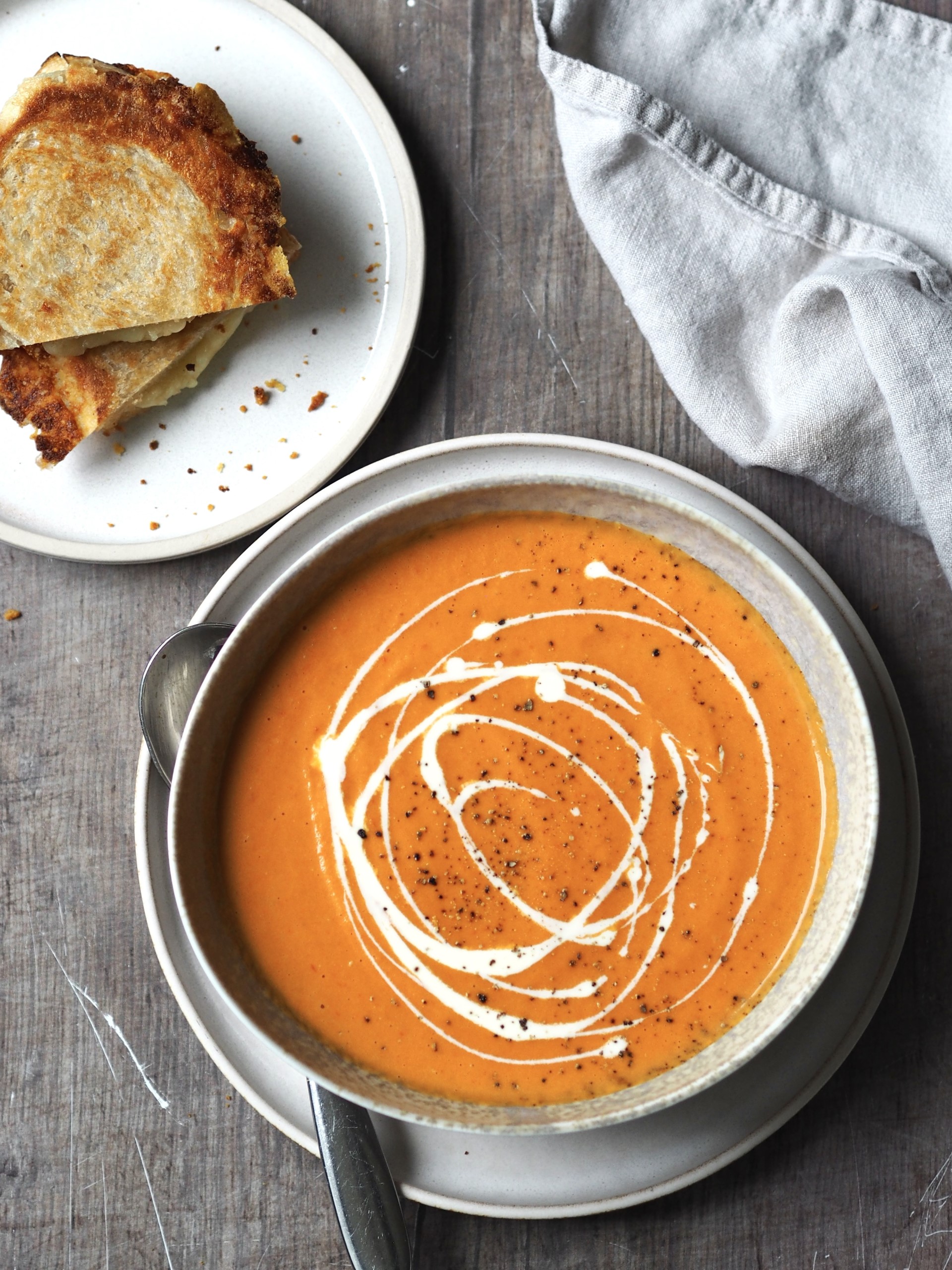 Serving tomato soup with grilled cheese