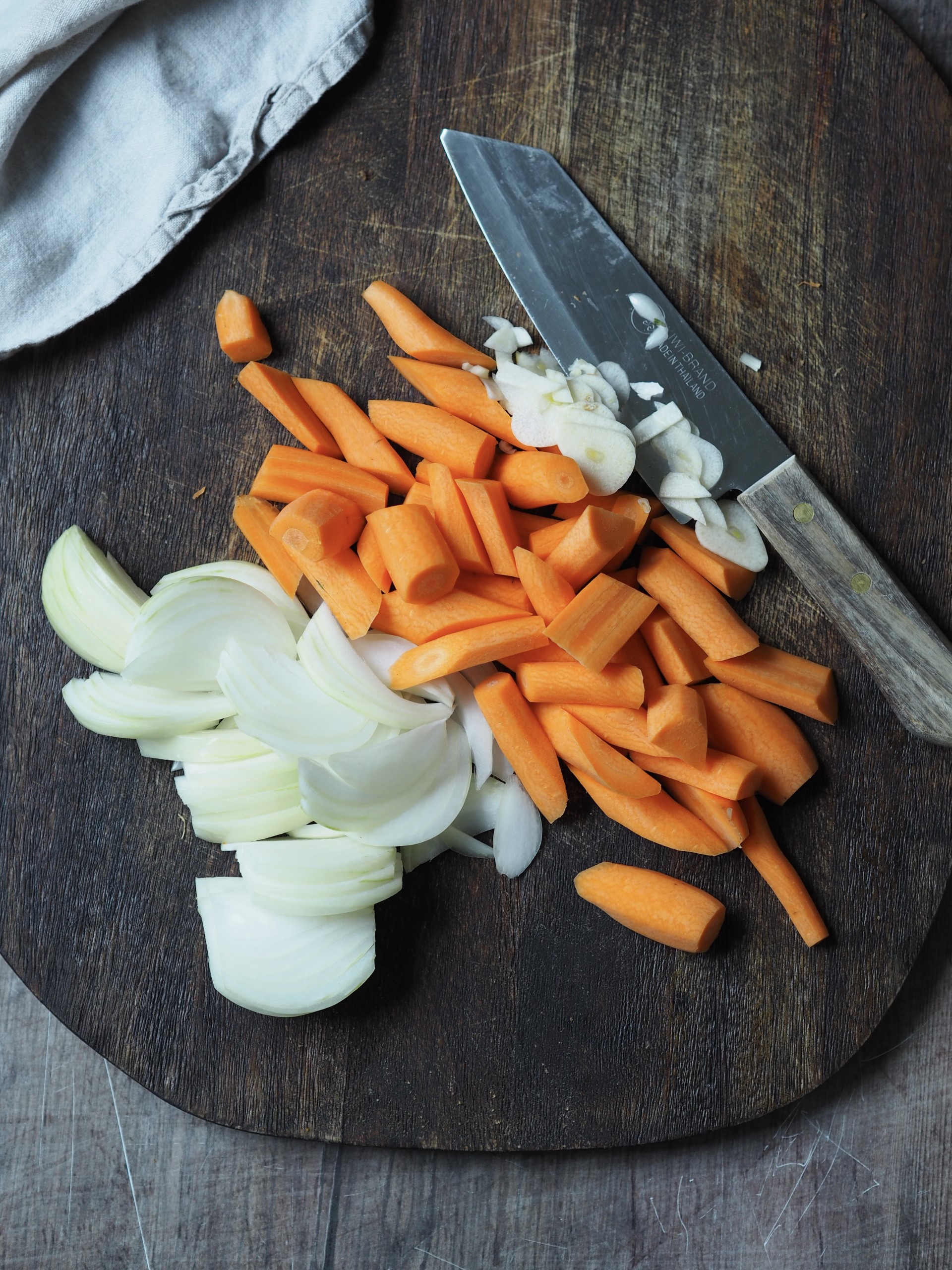 Chopping onions, garlic and carrots