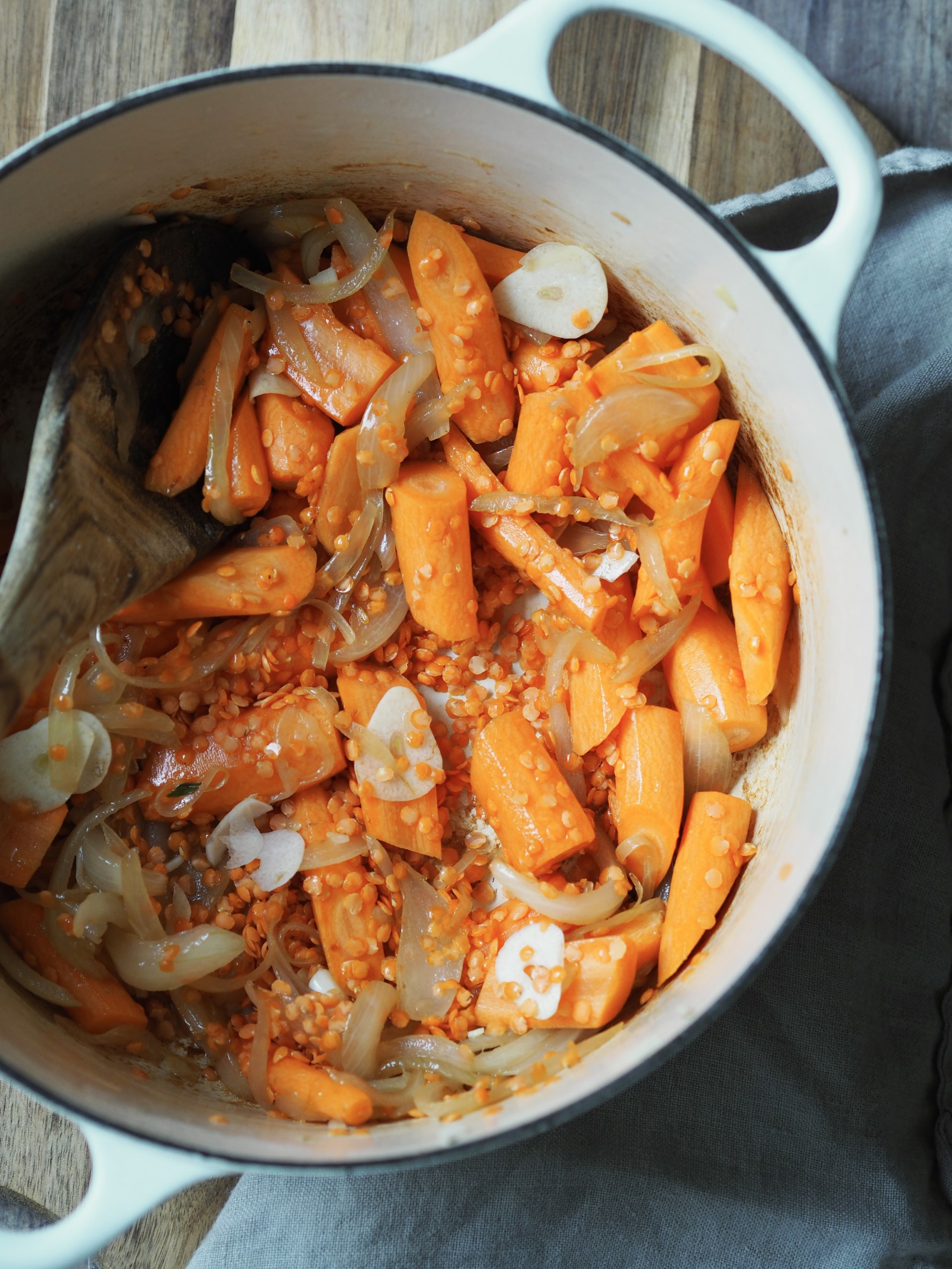 Adding carrots to the soup