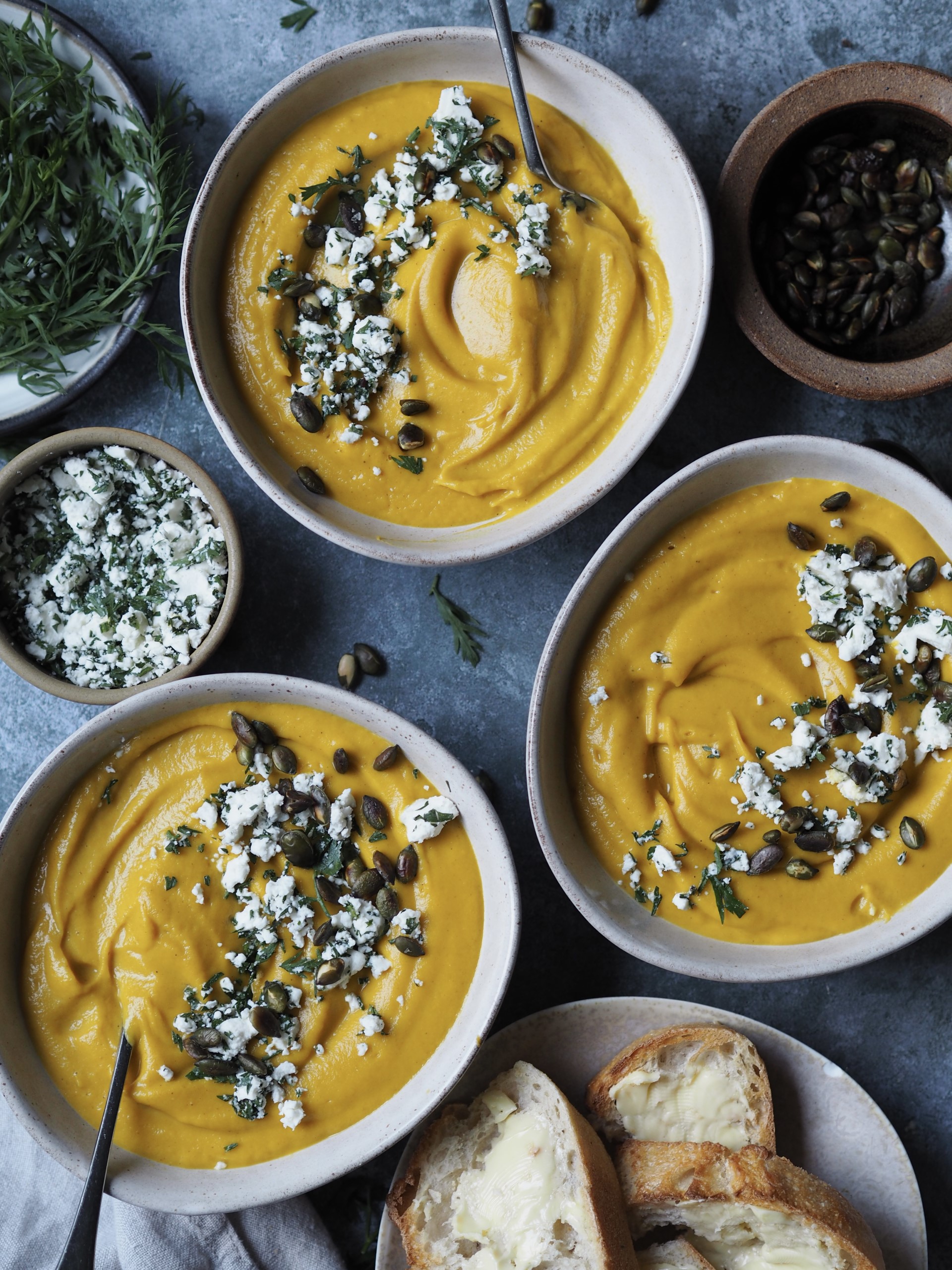 Serving Spiced Carrot Soup with bread and feta