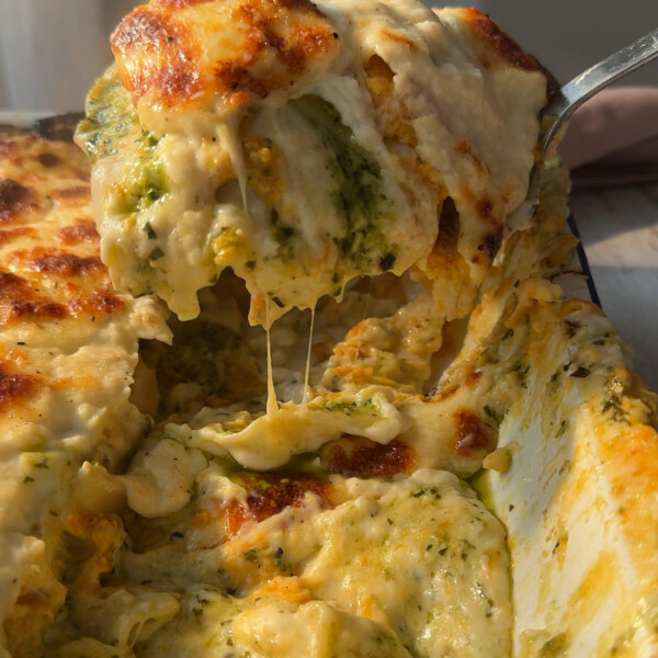 slicing into pesto lasagne with butternut squash