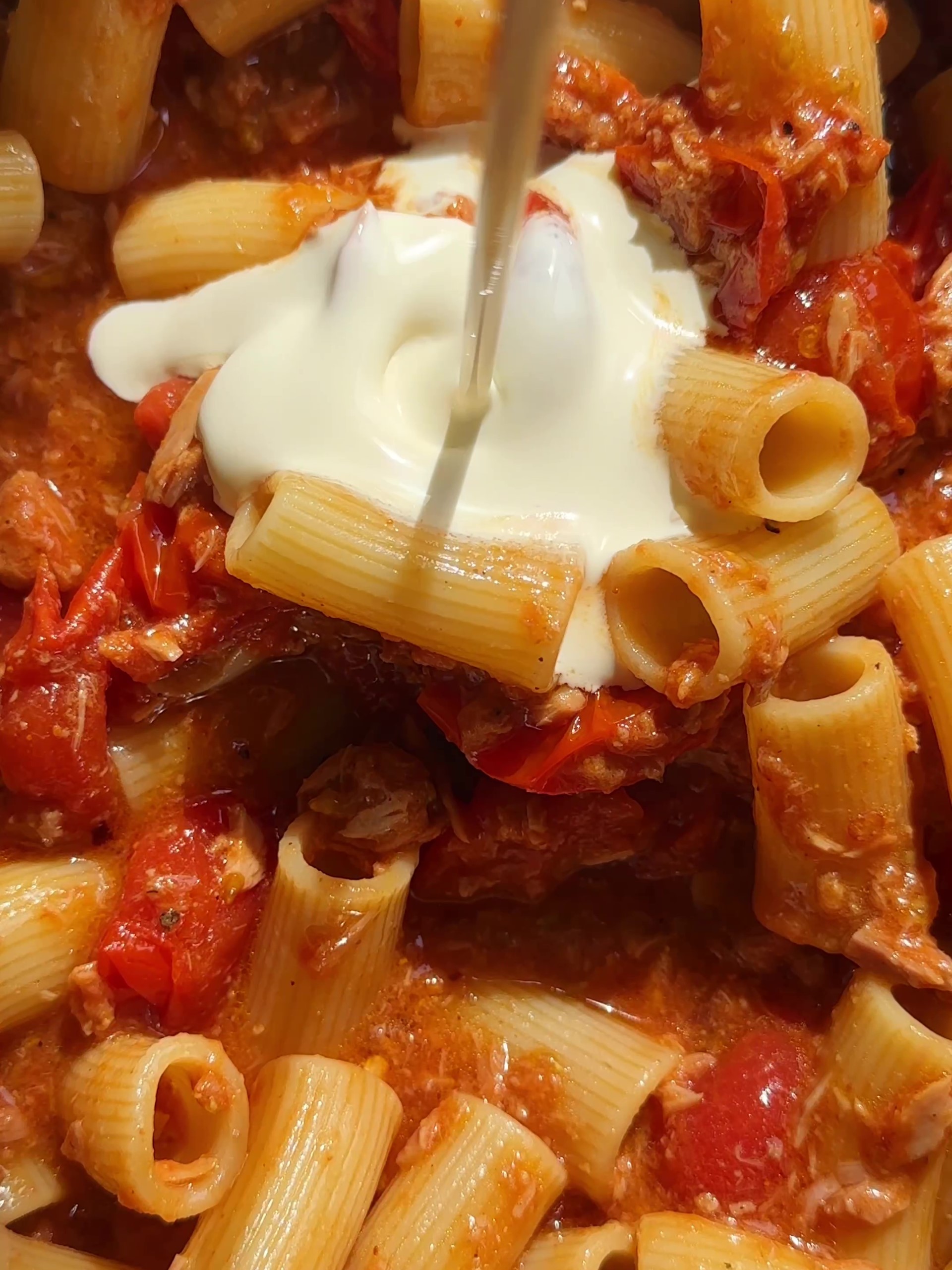 Adding cream to pasta