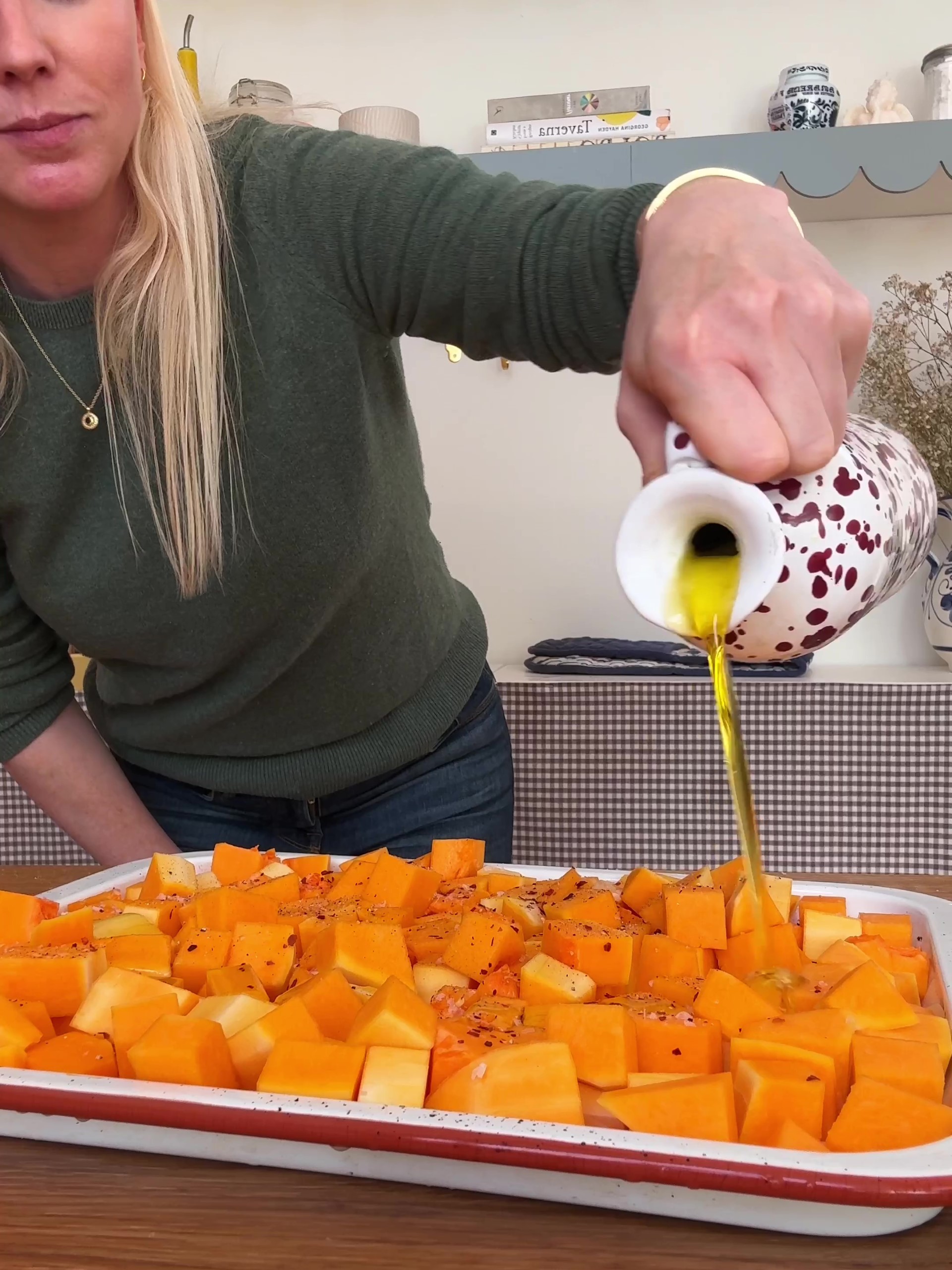 Drizzling butternut with olive oil