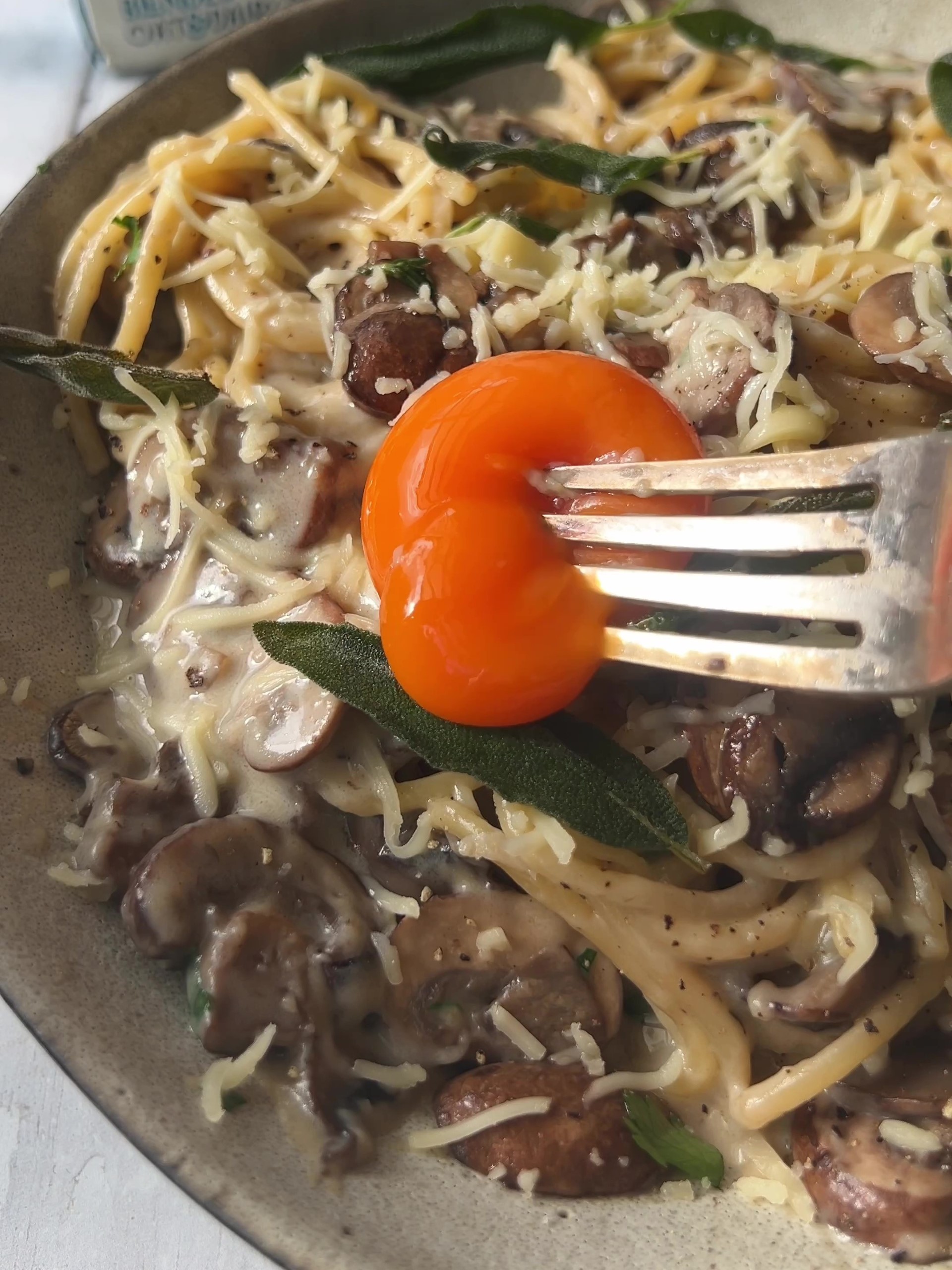 Breaking egg yolk with a fork