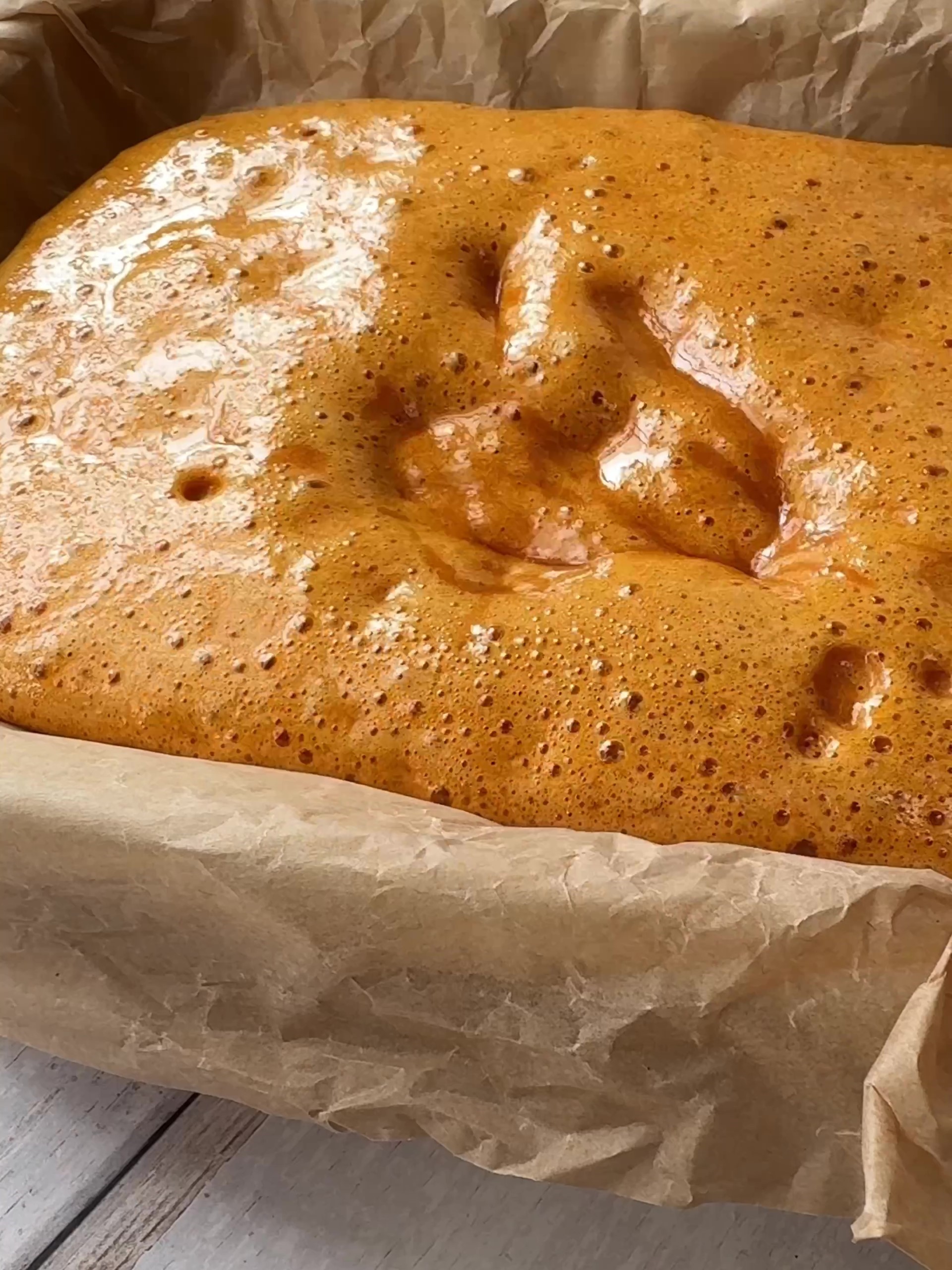 Pouring hot honeycomb mixture into baking tin