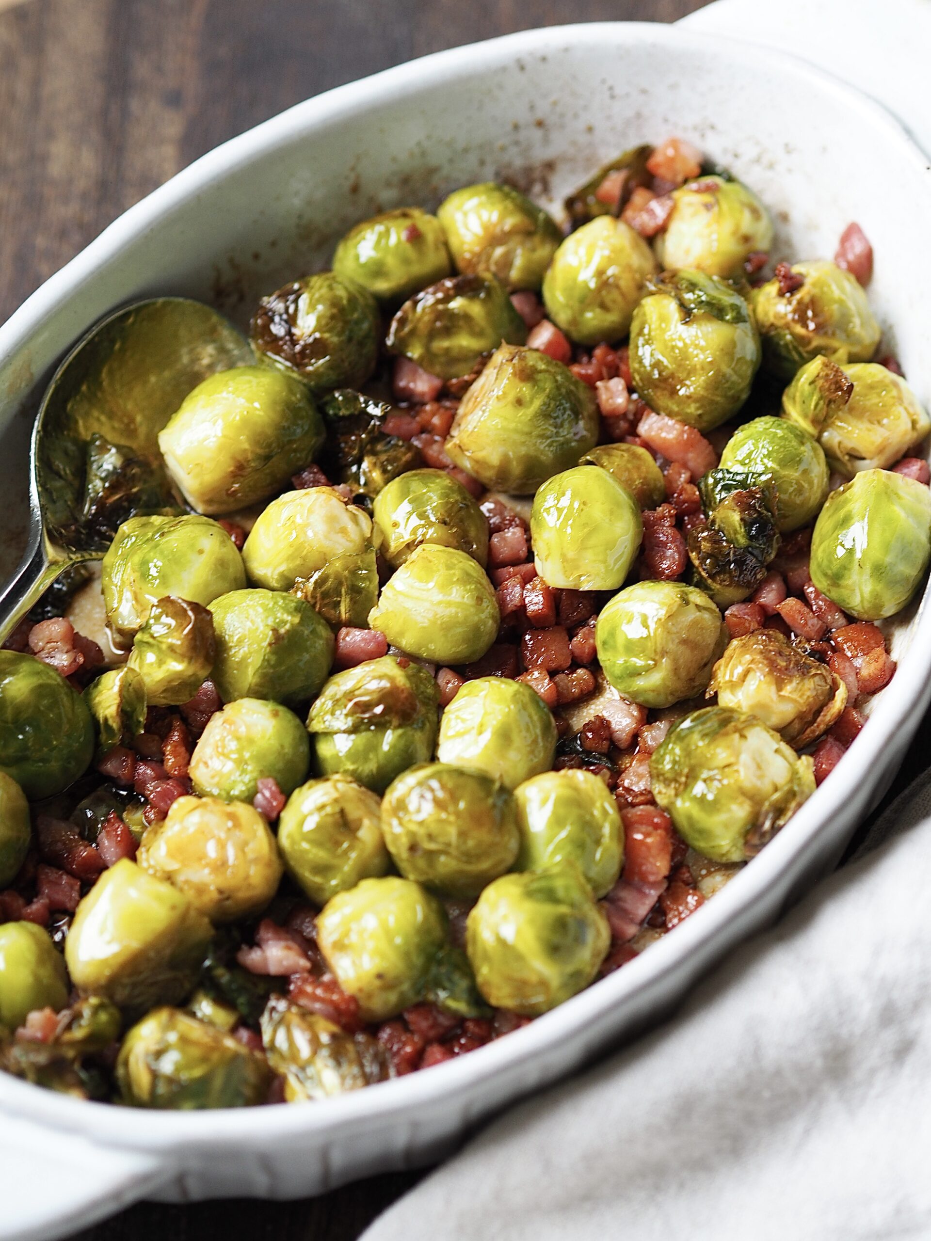 Roasted brussels sprouts with cooked bacon lardons tossed in honey and balsamic vinegar.