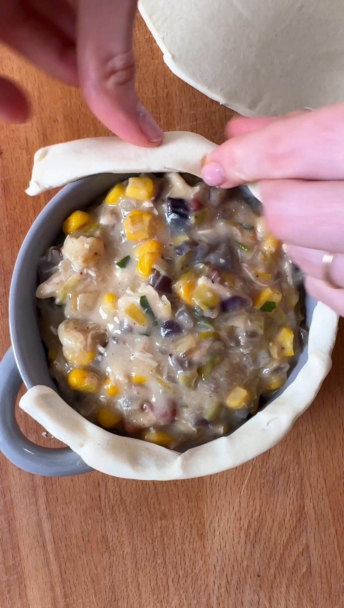 adding pastry to the edges before covering with a lid