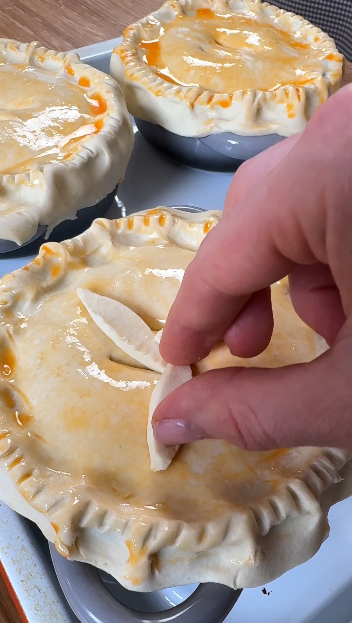 top with decorative pastry and poke with a knife