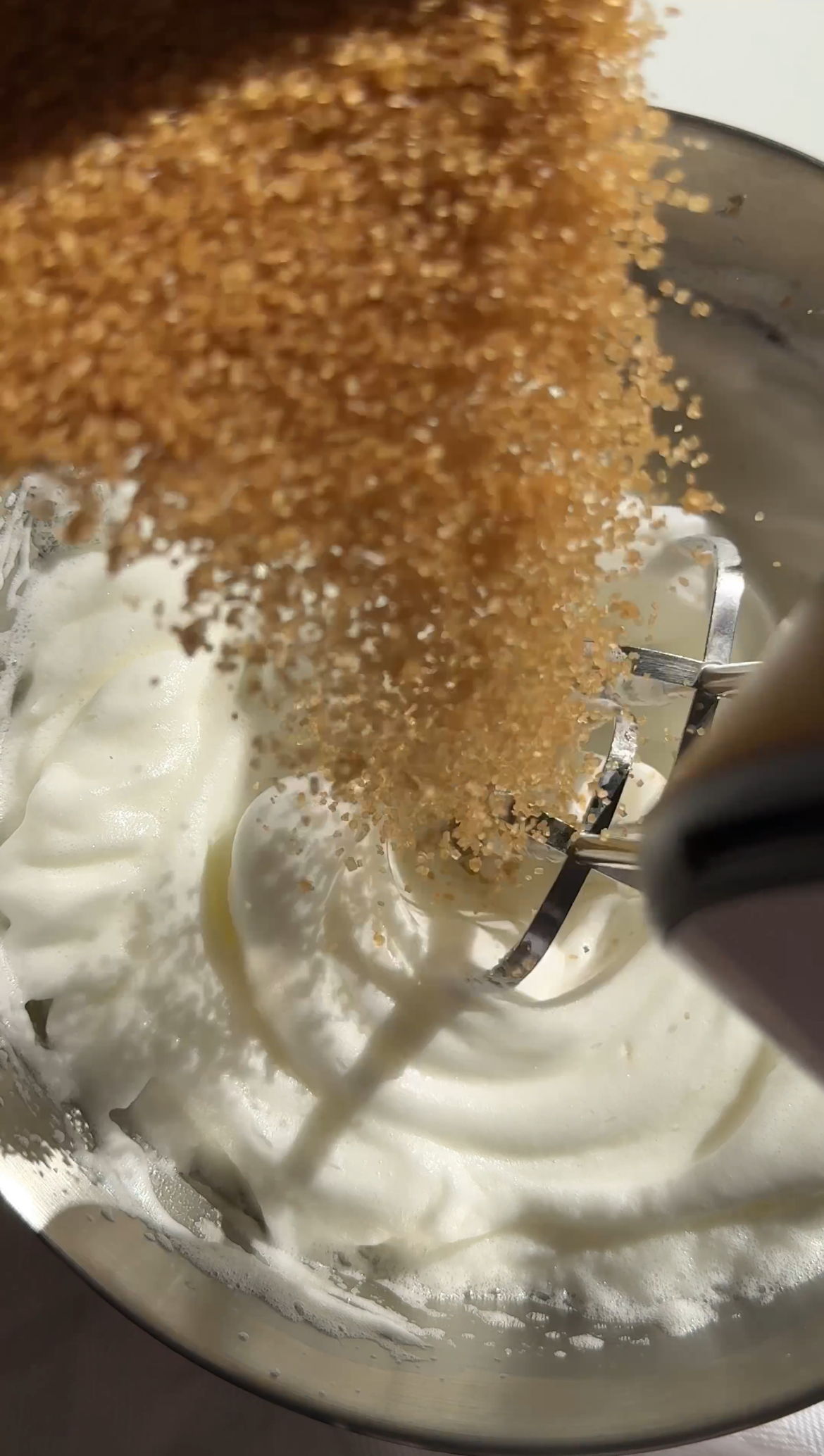 adding brown sugar to meringue