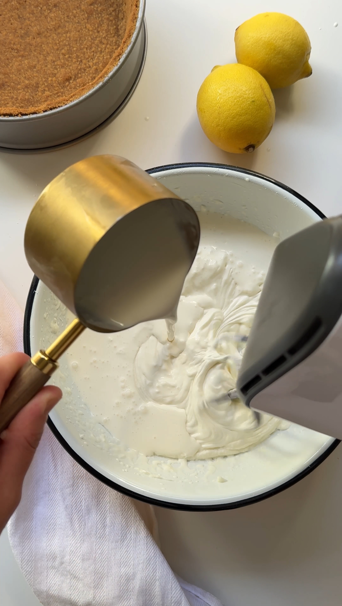 streaming cream into cheesecake mixture