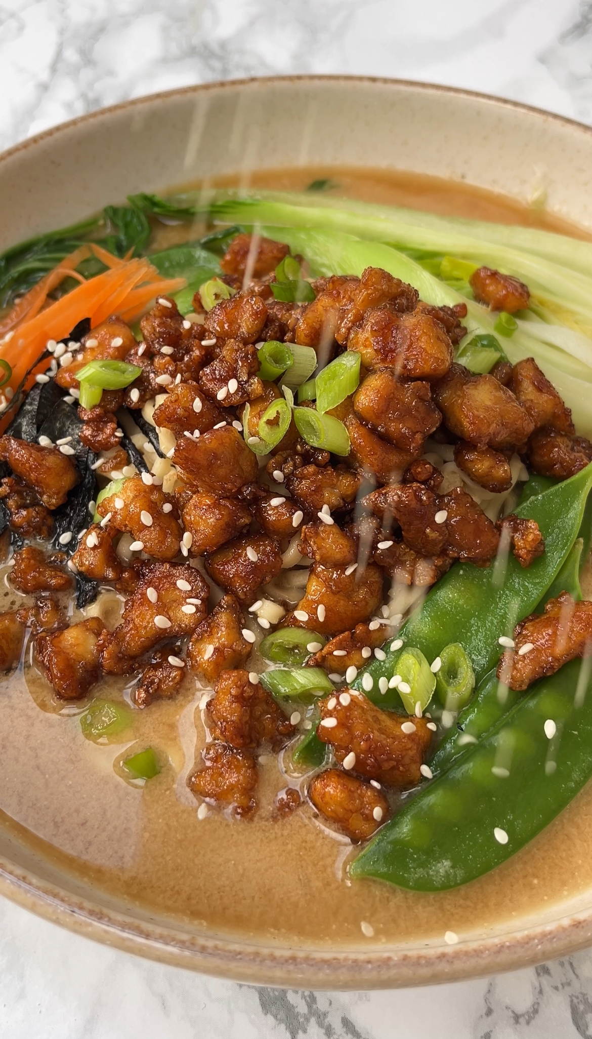 add noodles veg and crispy tofu to the soup base for tofu noodle soup