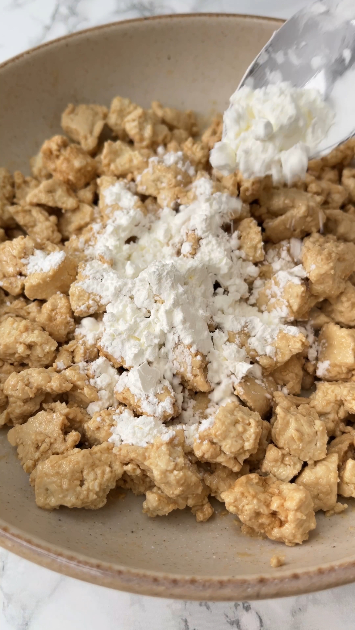 adding cornflour to the tofu before frying