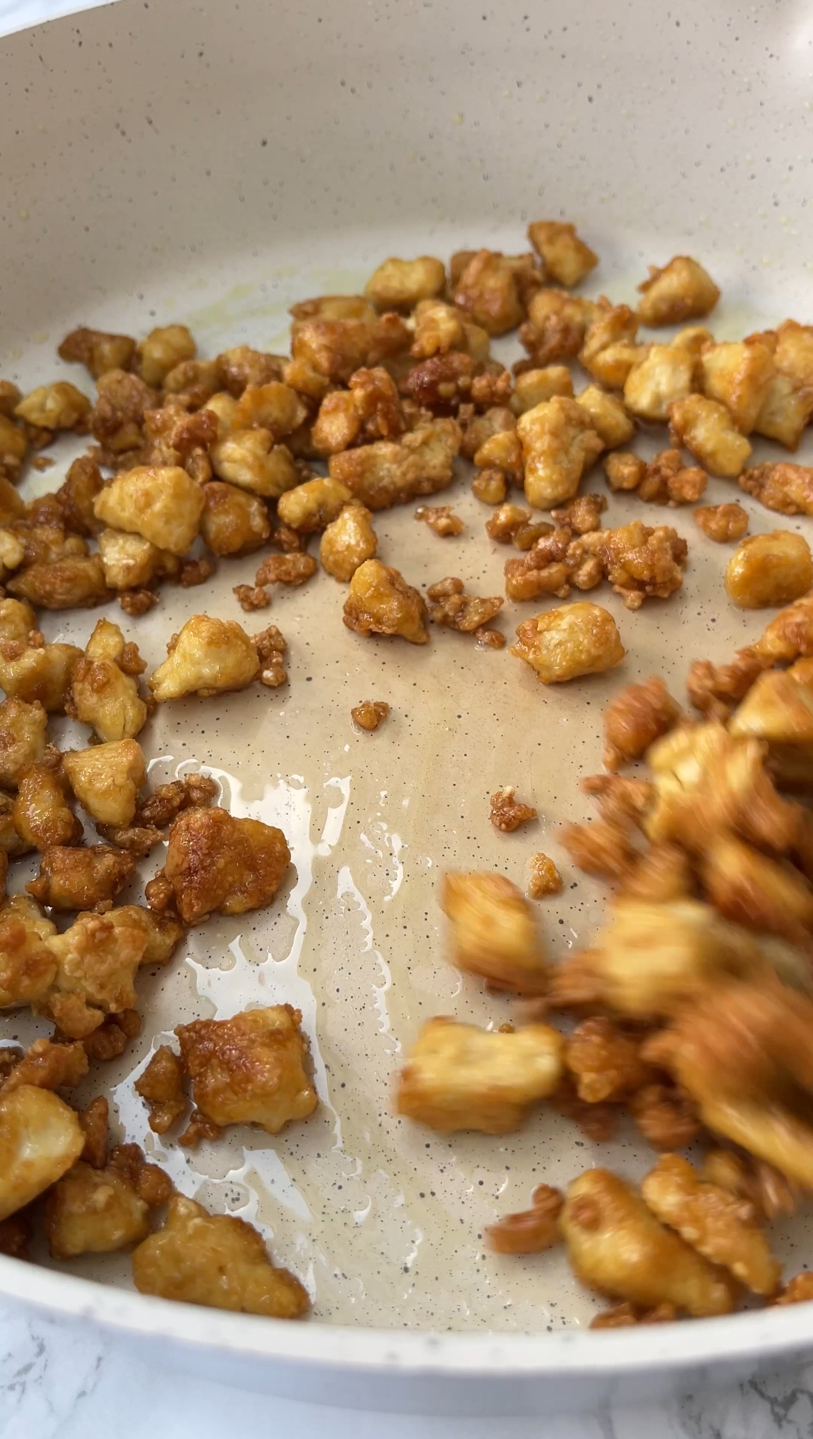 frying the tofu until crispy