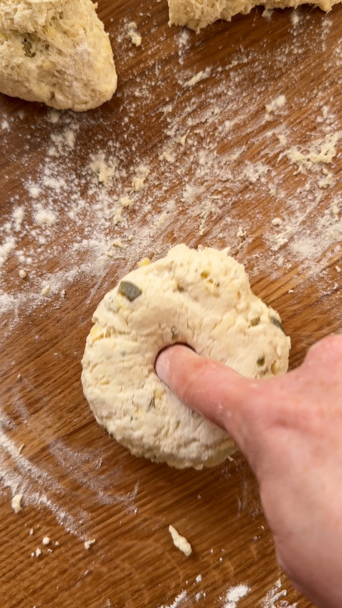 shaping the dough into bagel shape.