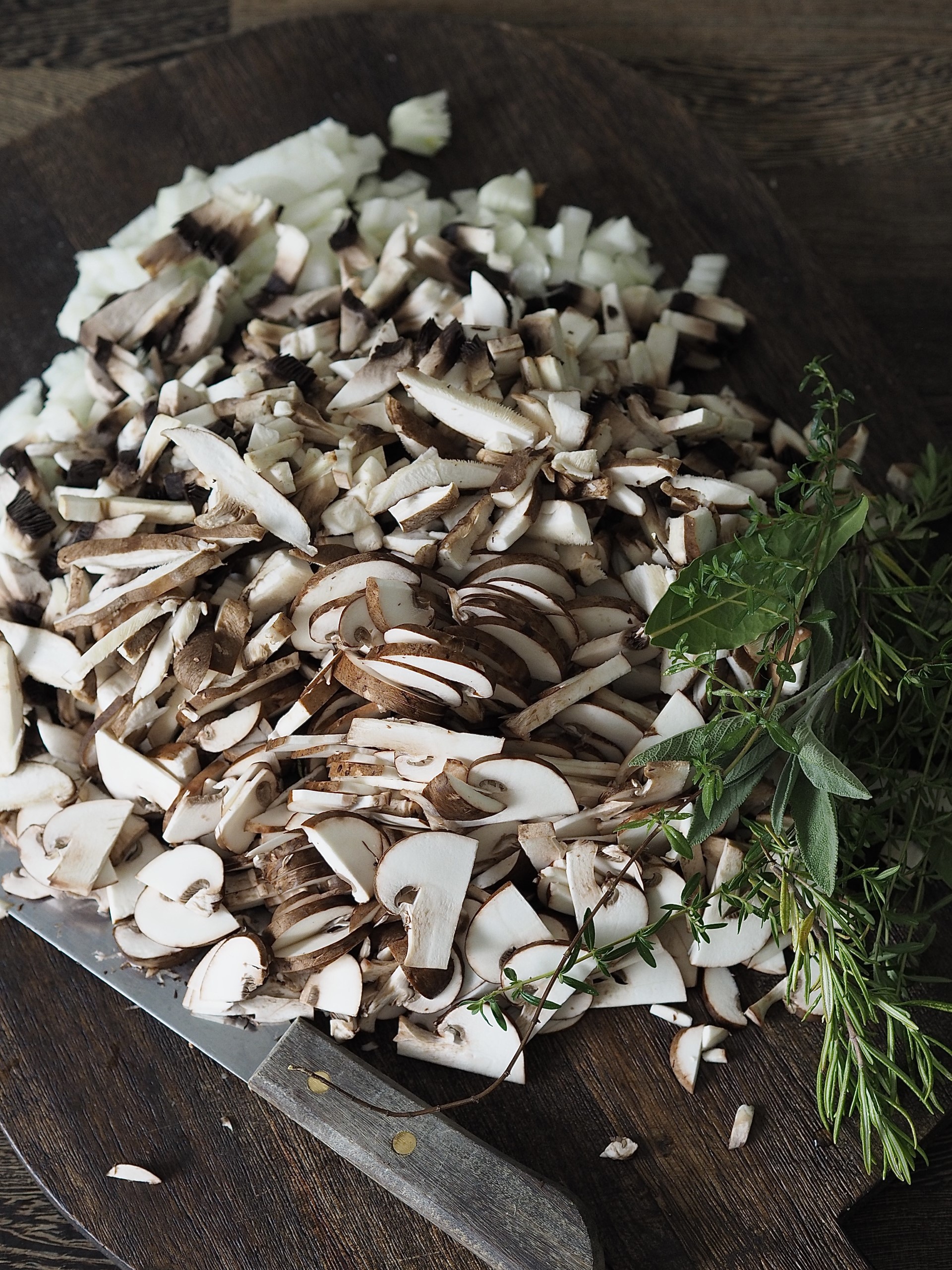 Sliced fresh mushrooms on a chopping board