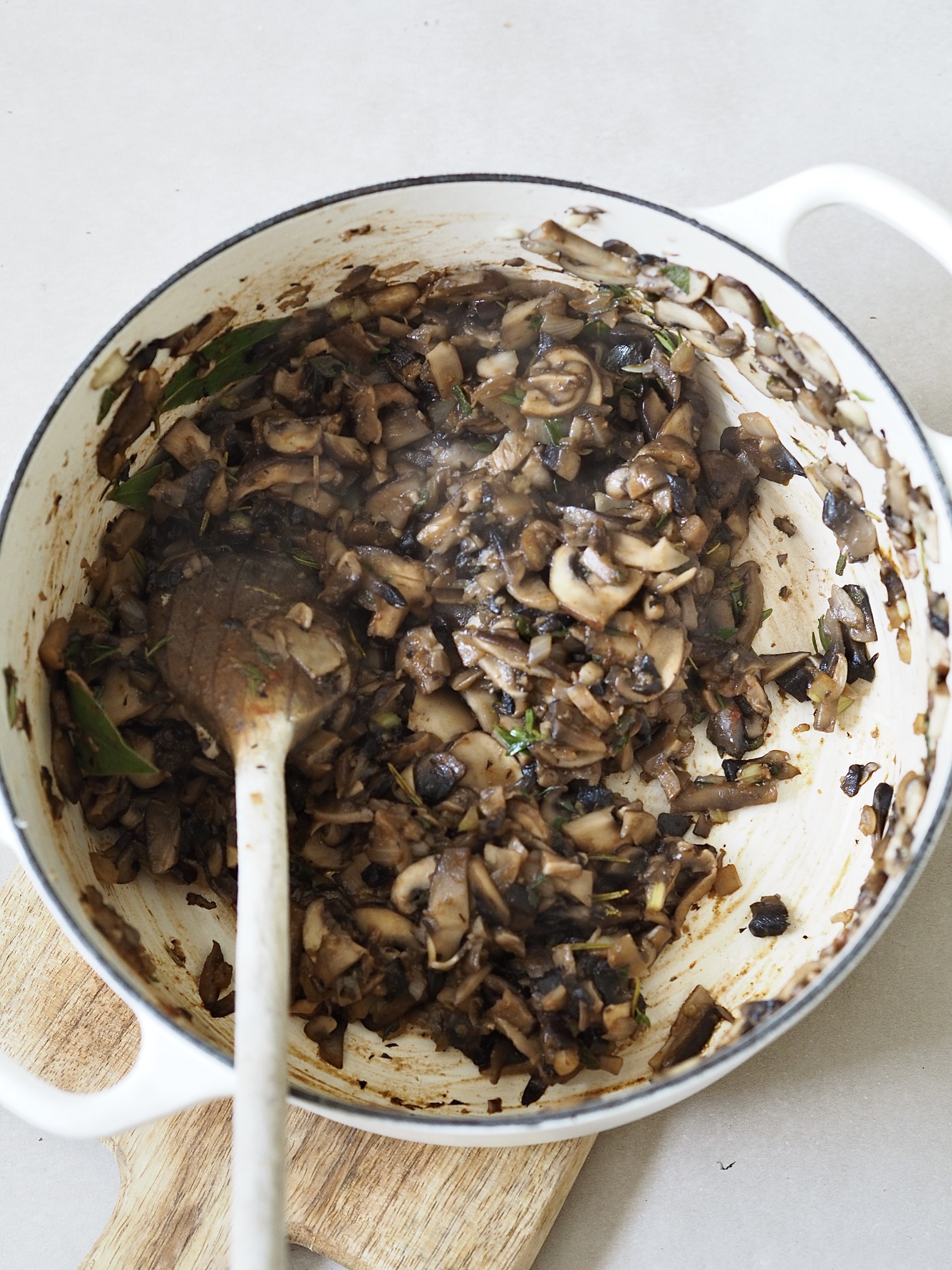 Frying mushrooms in a pot