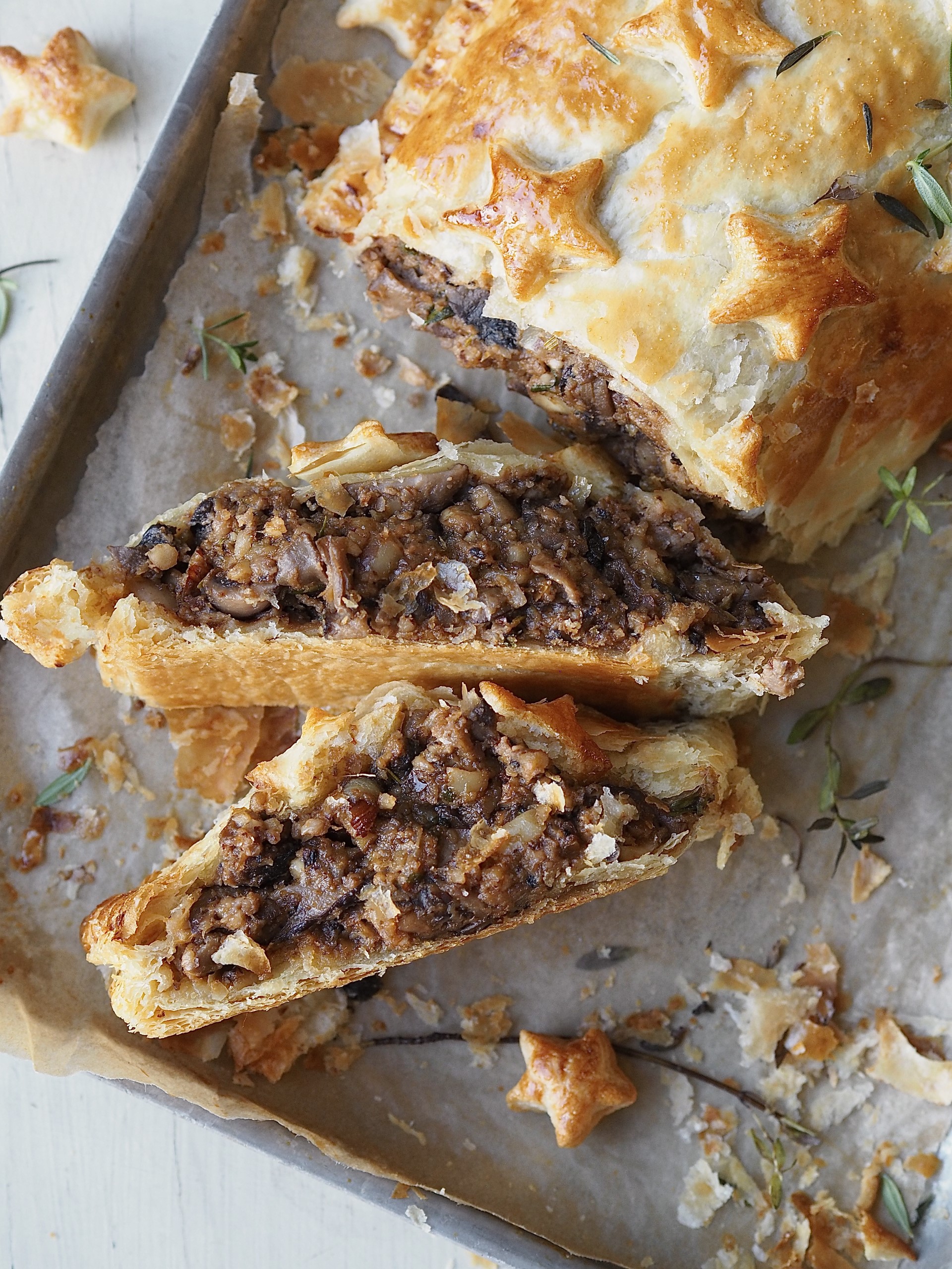 Slices of Nut Roast Wellington in a baking dish