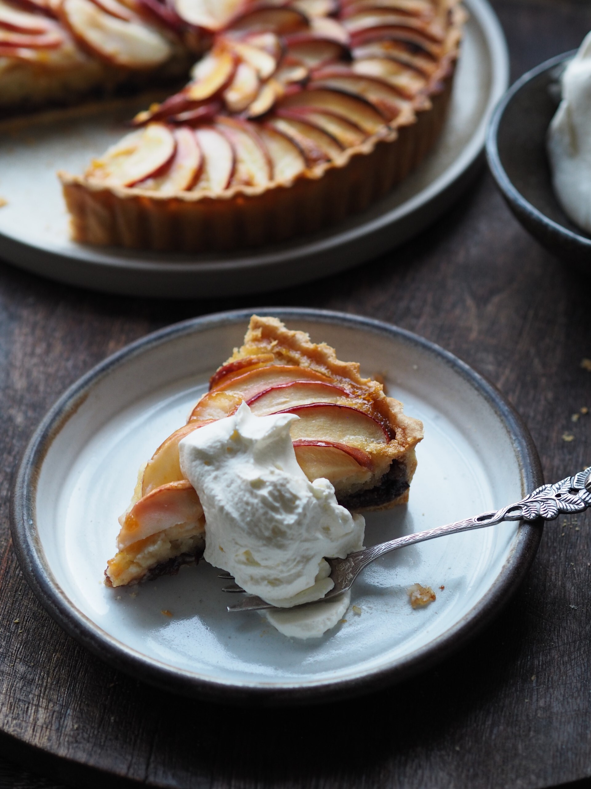 Slice of Mincemeat and Frangipane Tart in a plate with cream