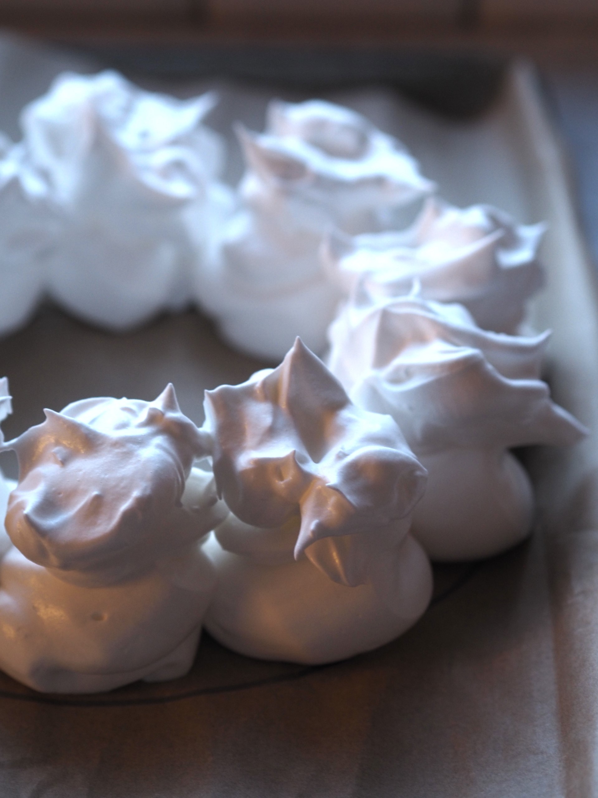 Placing the meringue in the oven.