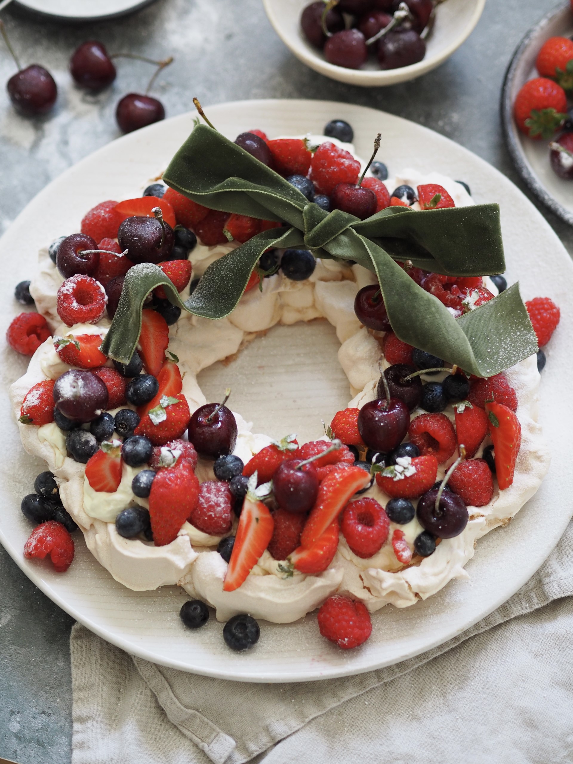 Christmas Pavlova on a plate with a ribbon