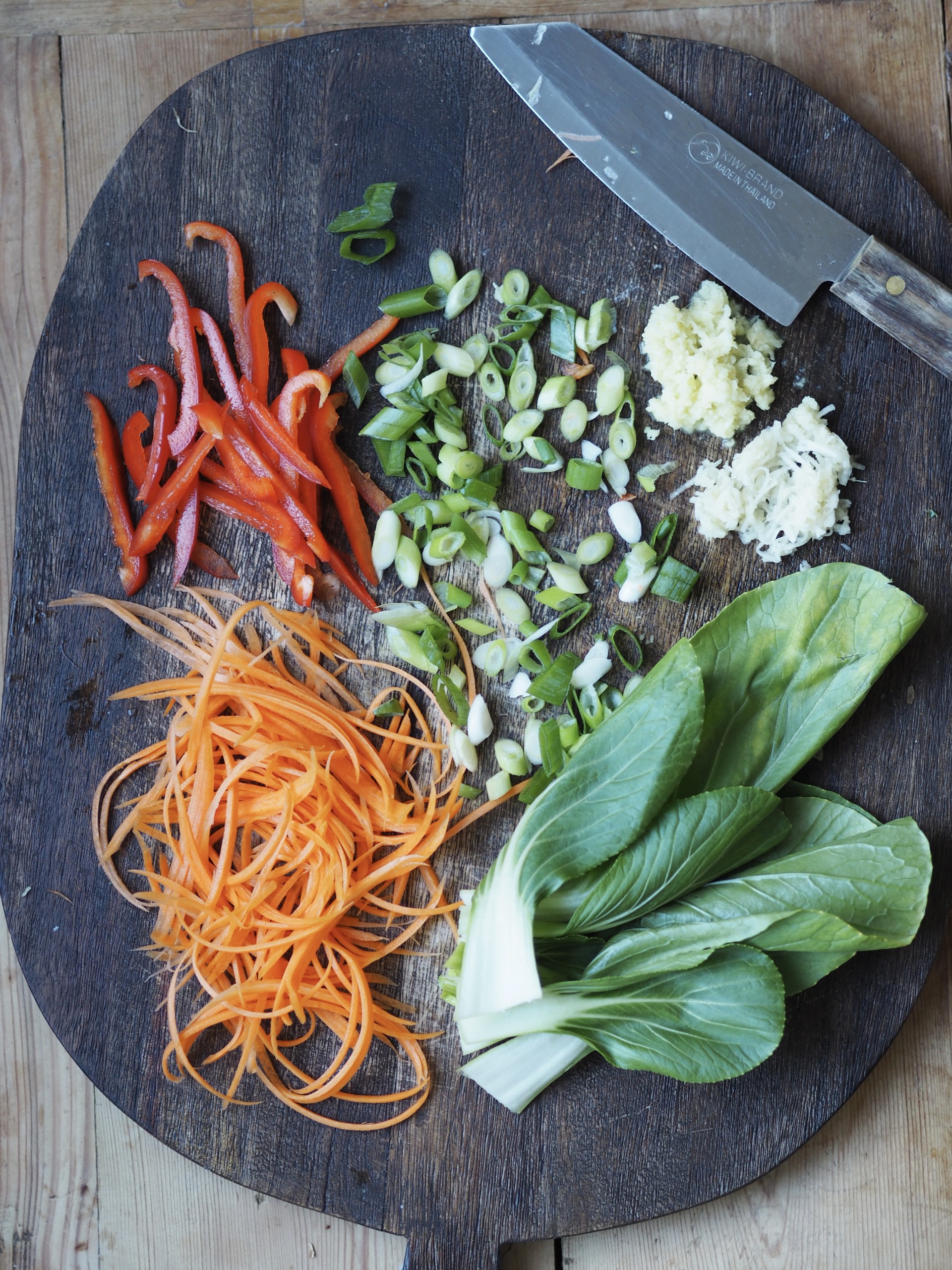 Wooden tray with uncooked vegetables