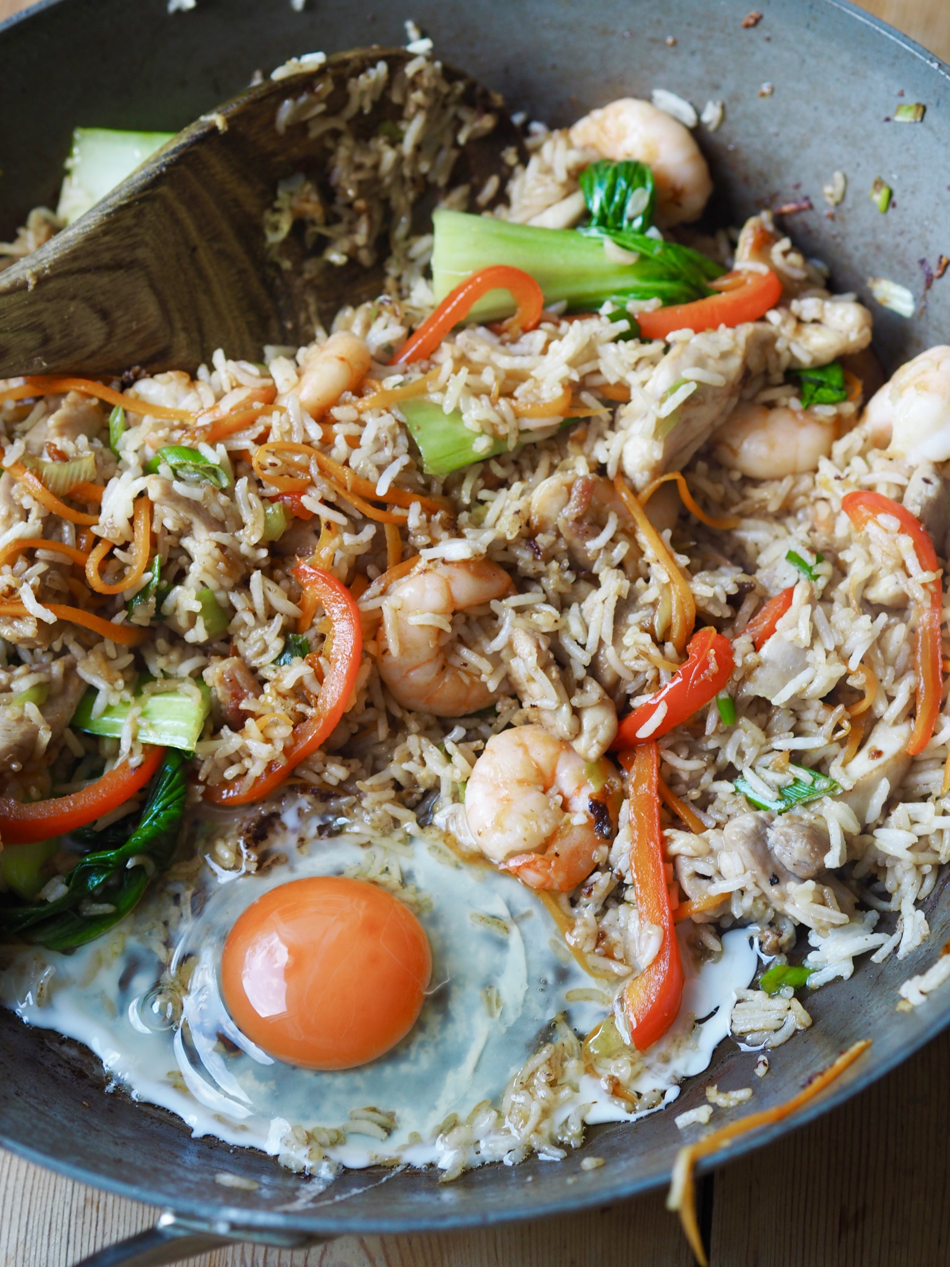 Adding a n egg to the rice mixture