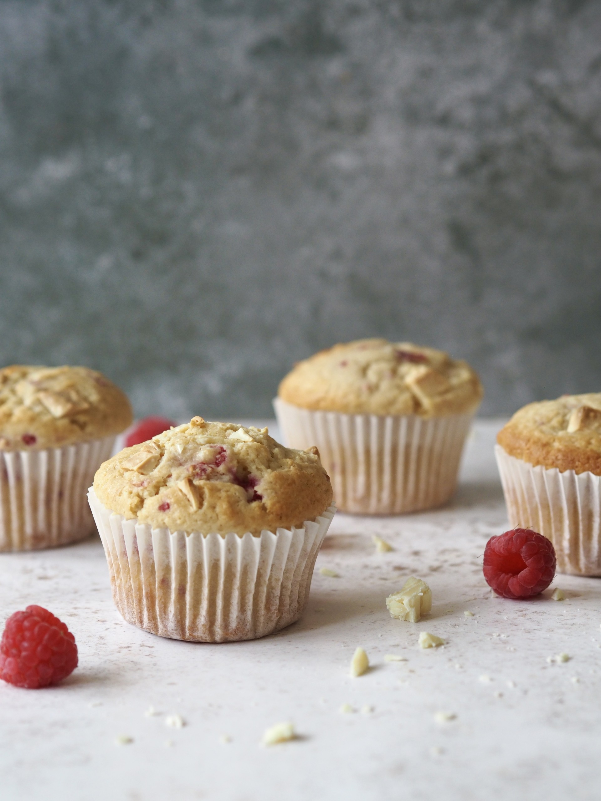 A couple of baked Raspberry White Chocolate Muffins