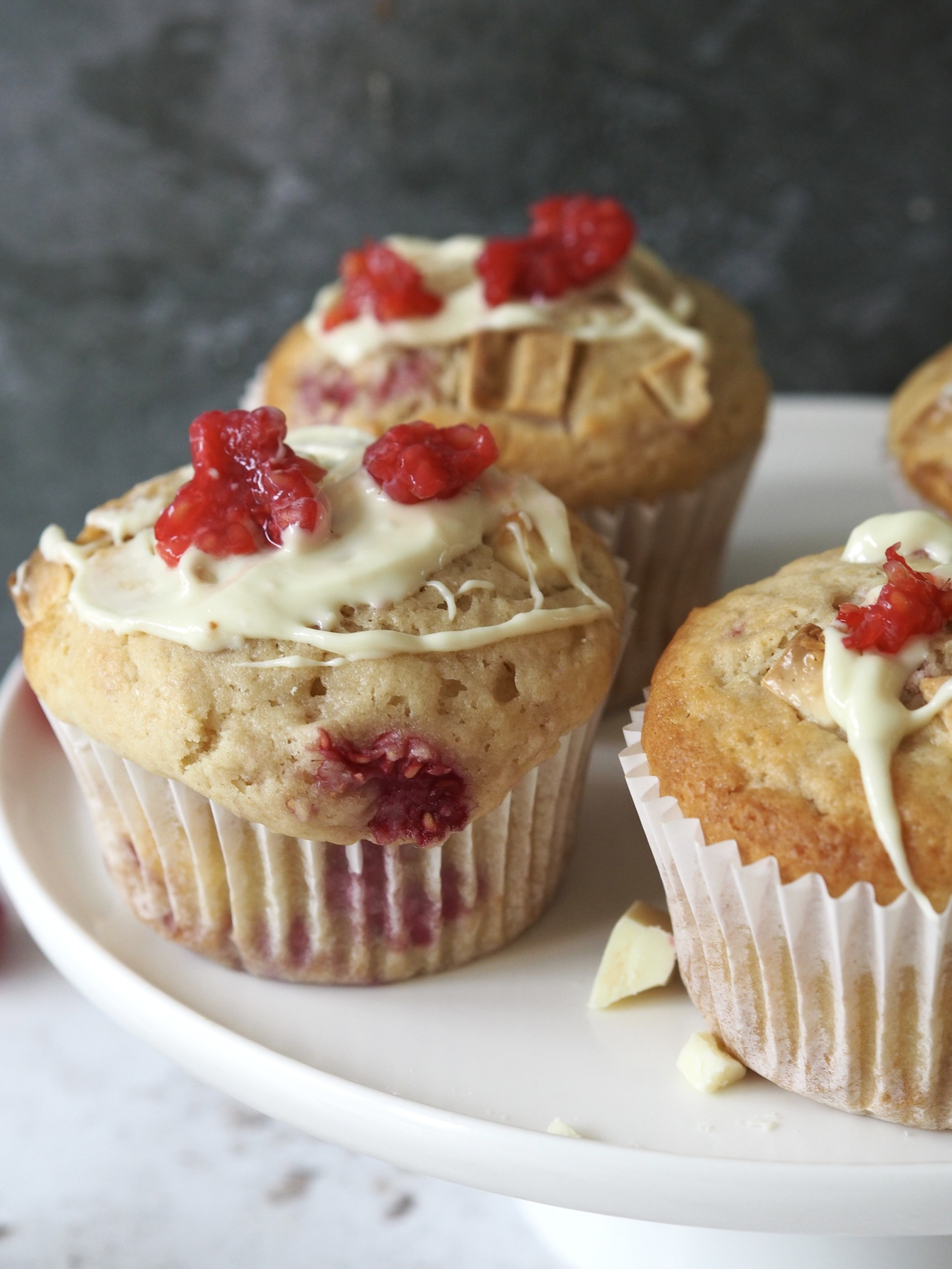 A muffin drizzled with white chocolate