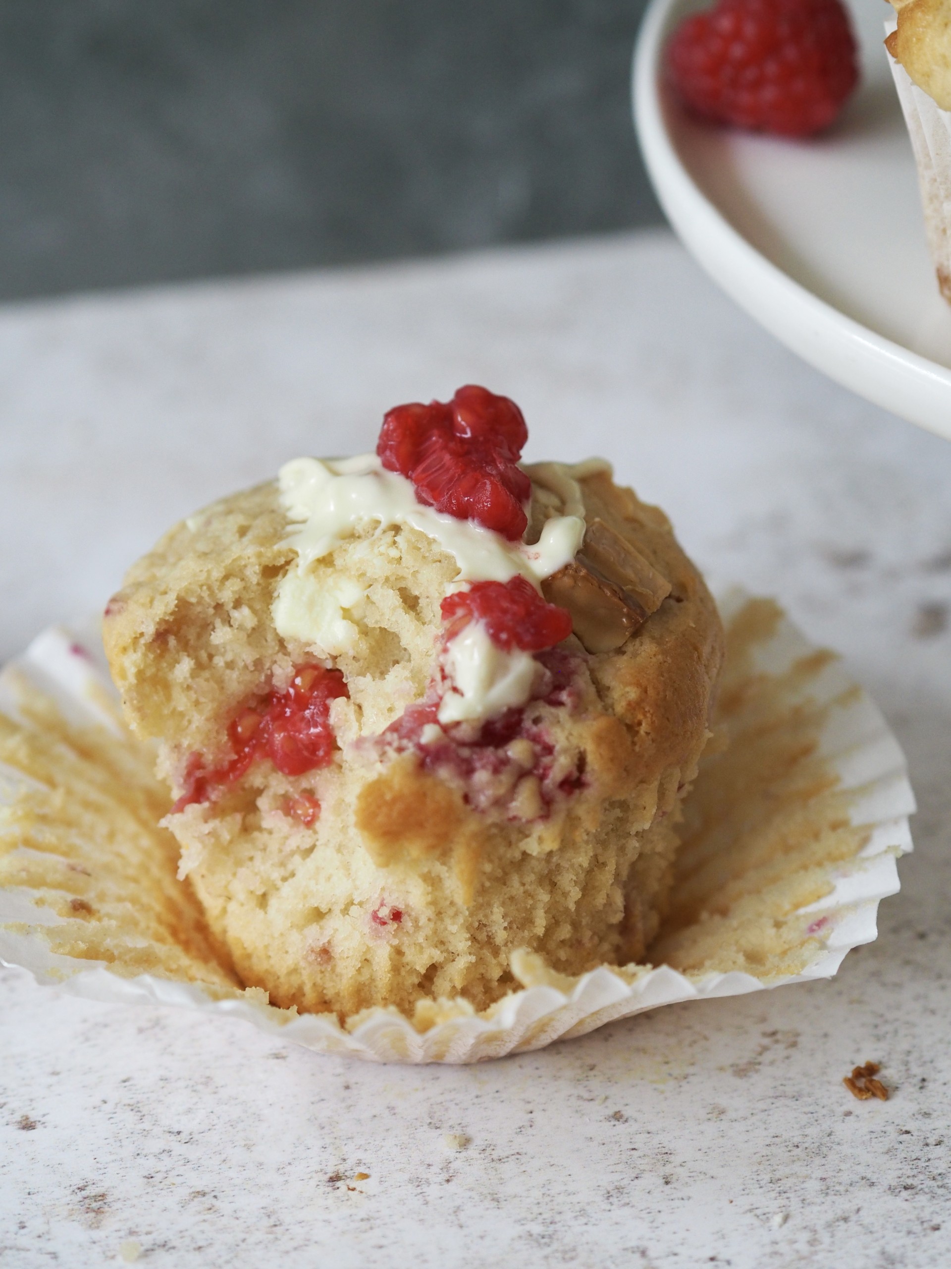 A single Raspberry White Chocolate Muffin