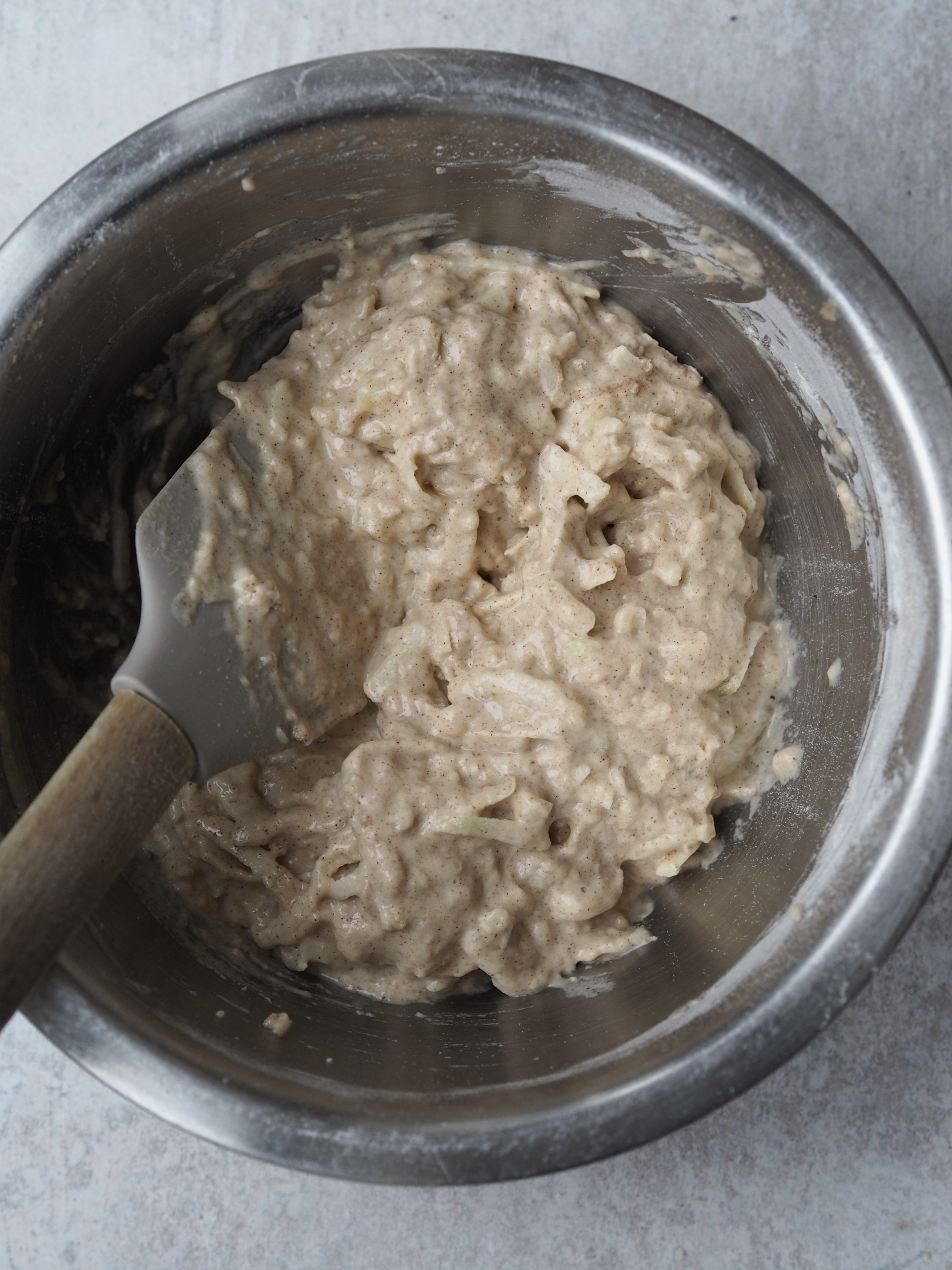 Adding grated apples to the batter