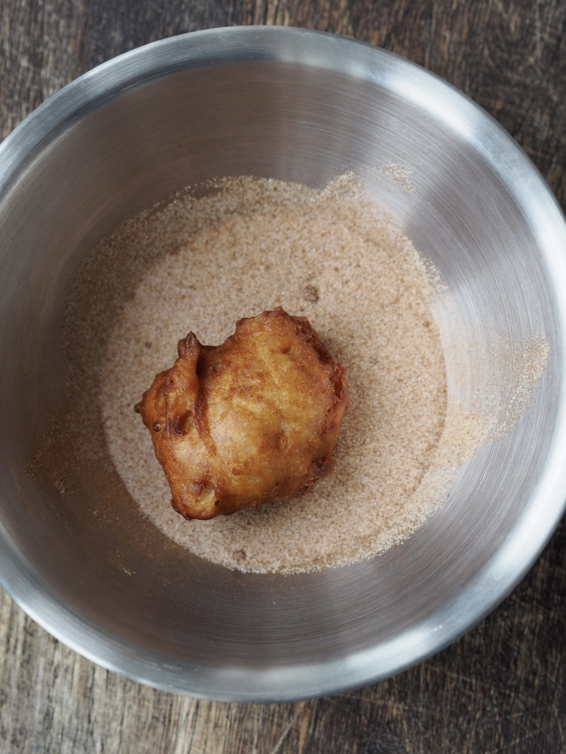 Coating the Apple Sauce Fritters with cinnamon sugar