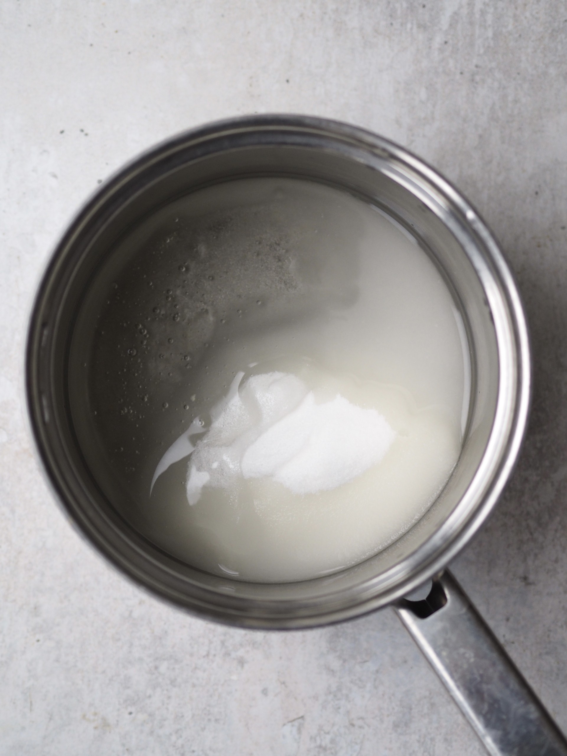 Adding sugar to a sauce pan