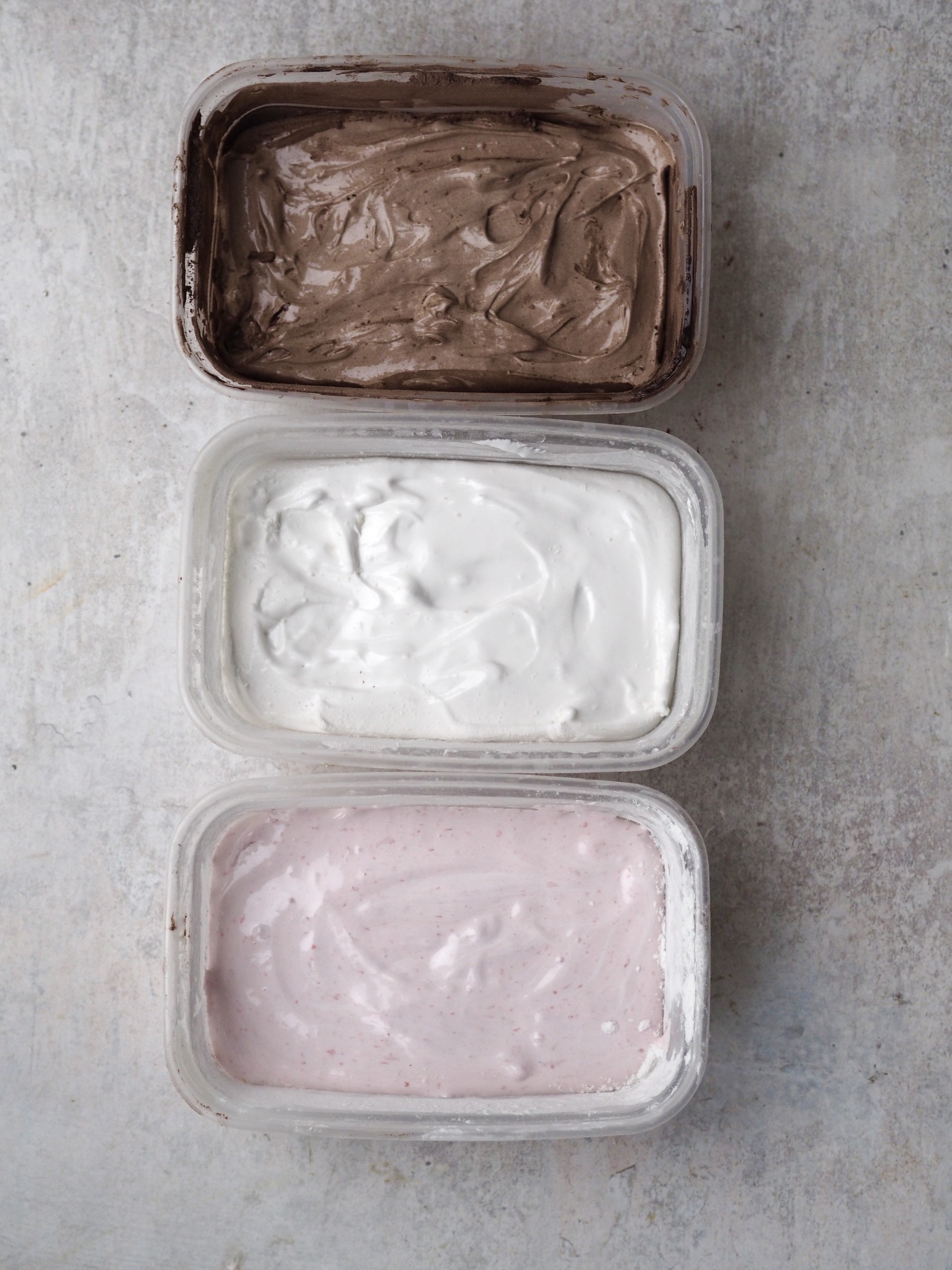 Three containers with different flavours marshmellow mixture